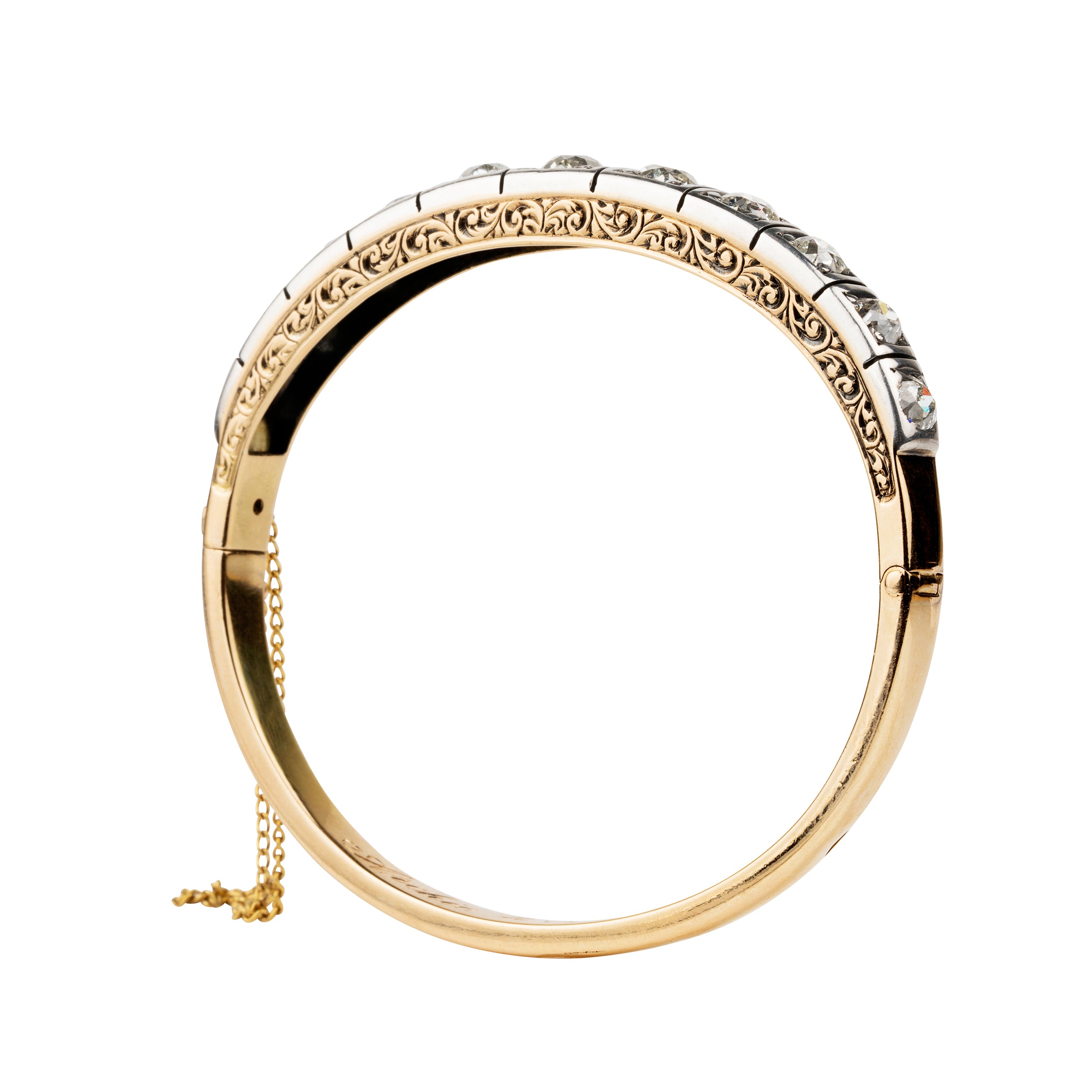 Victorian revival diamond bangle, in silver topped 15k gold. Eleven graduated old European cut diamonds, approximately 4 carats in total diamond weight. Found in Finland. European in origin. Circa 1920. 