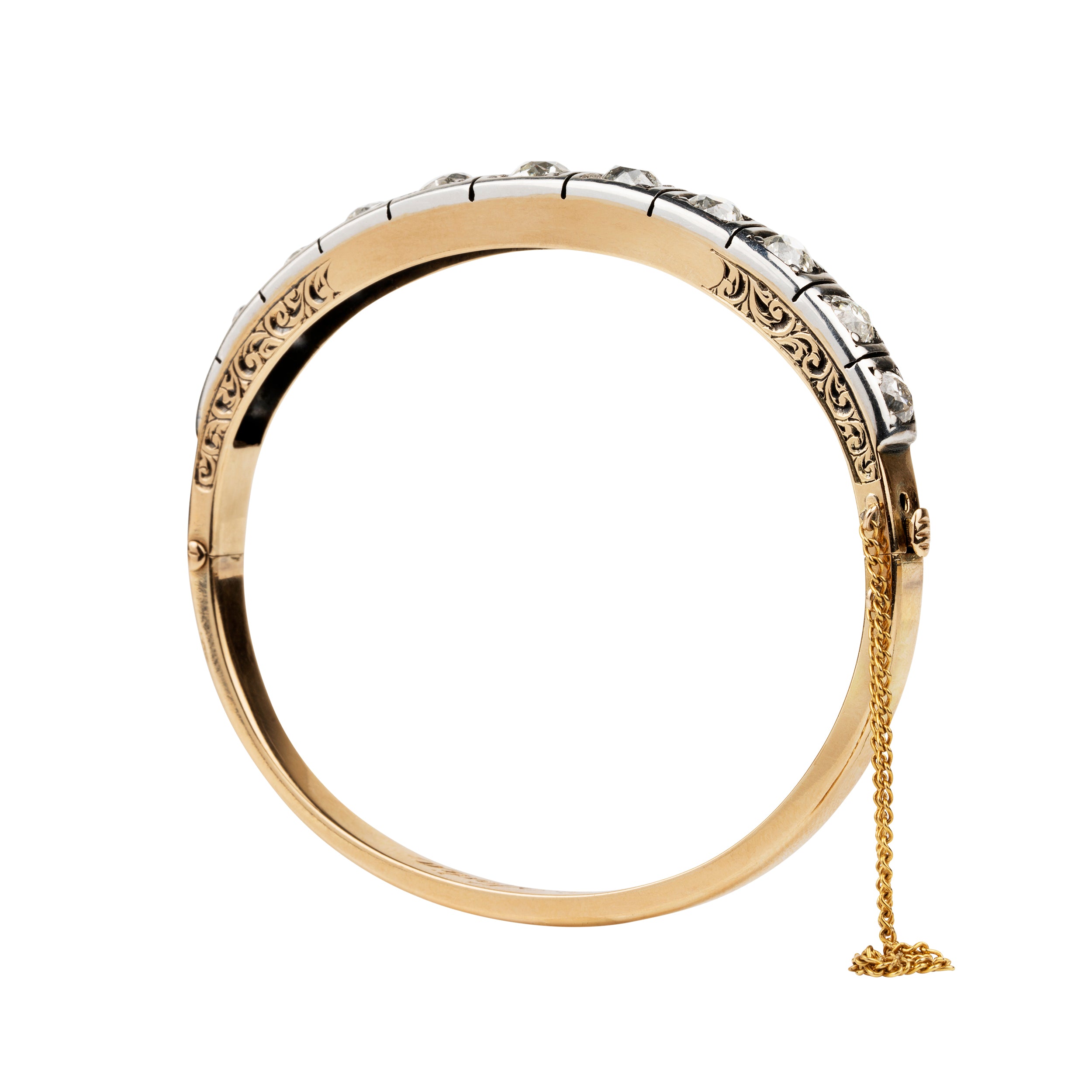 Victorian revival diamond bangle, in silver topped 15k gold. Eleven graduated old European cut diamonds, approximately 4 carats in total diamond weight. Found in Finland. European in origin. Circa 1920. 