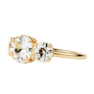 A classic three-stone diamond ring in our 18k old gold featuring a slim band. The center stone is set with four tab prongs. This example features three old European cut diamonds. The center stone in this example is 1.93-carat diamond, GIA-certified H color, and VS1 clarity. Flanked by 2 old European cut diamond side stones, 0.85 carats and 0.76 carats J Color/ VS1 clarity.