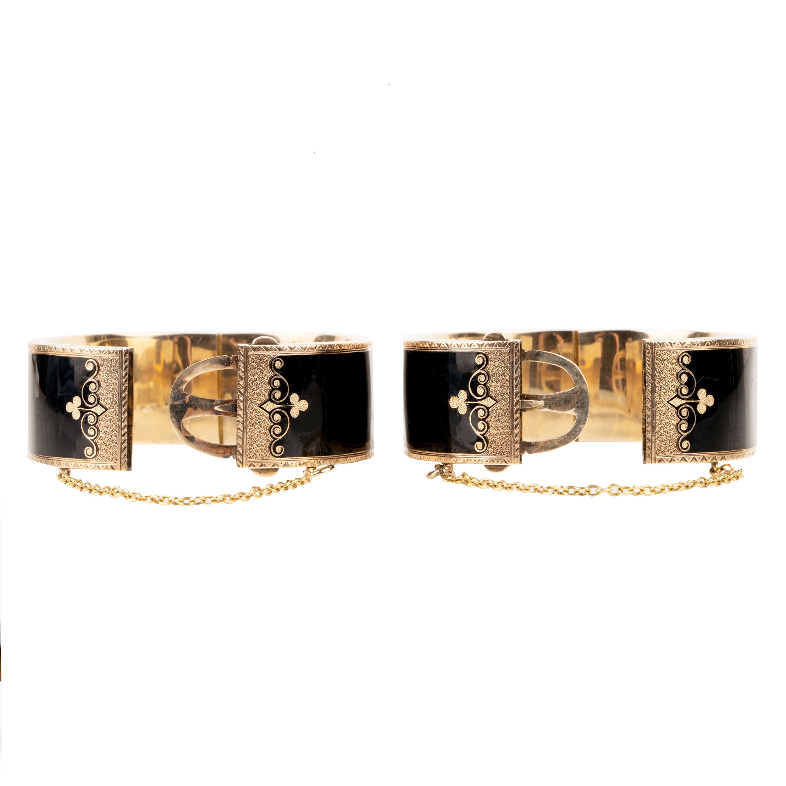 In the 19th century, the Lilly of the Valley flower was a common mourning motif that symbolized a return to happiness. This is a nicely preserved set of 14k gold bracelets with black enamel, pearls and delicate engraving. They are small in size, measuring 5.25 inches in circumference. American, circa 1870. Side view with claps opened.