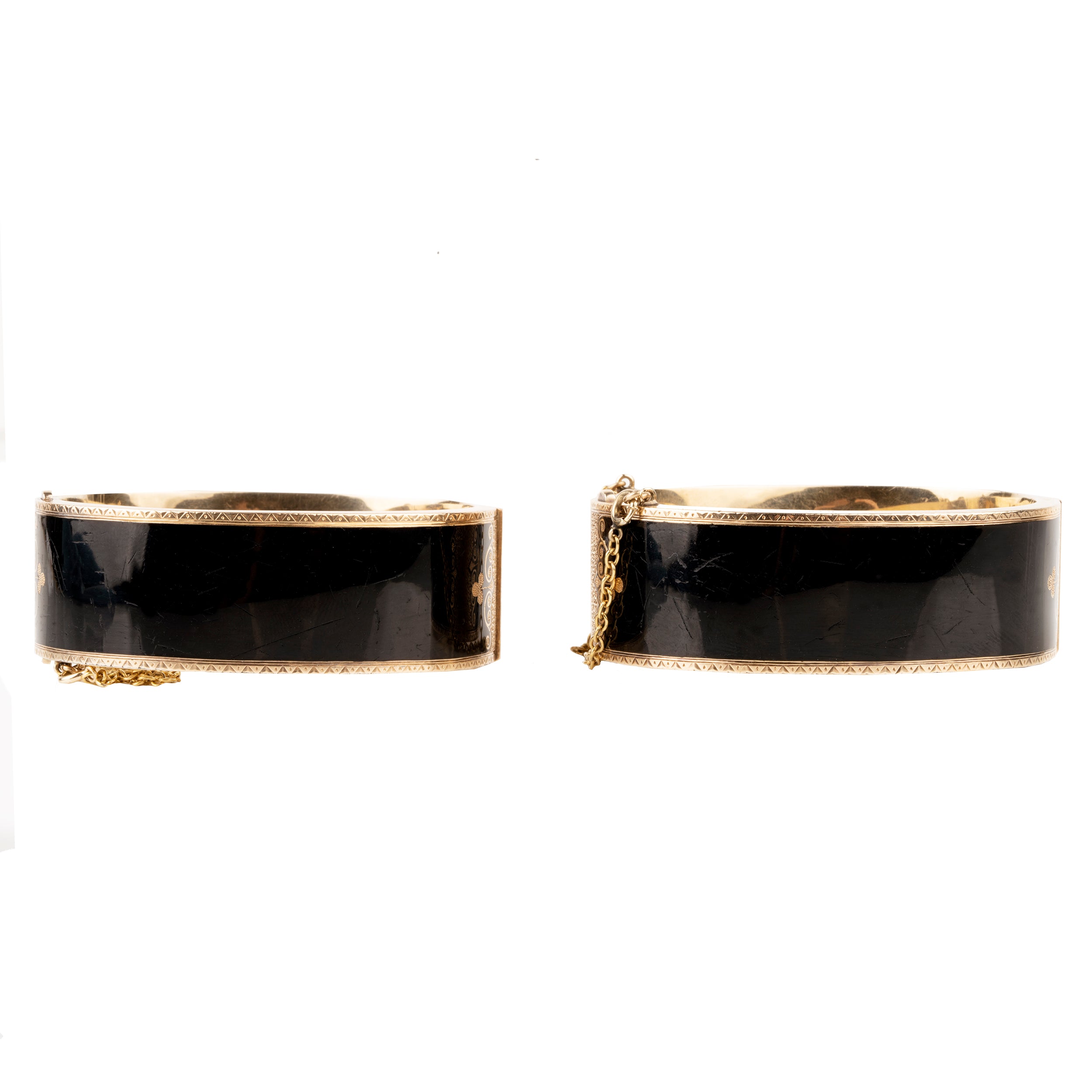 In the 19th century, the Lilly of the Valley flower was a common mourning motif that symbolized a return to happiness. This is a nicely preserved set of 14k gold bracelets with black enamel, pearls and delicate engraving. They are small in size, measuring 5.25 inches in circumference. American, circa 1870. Back view.