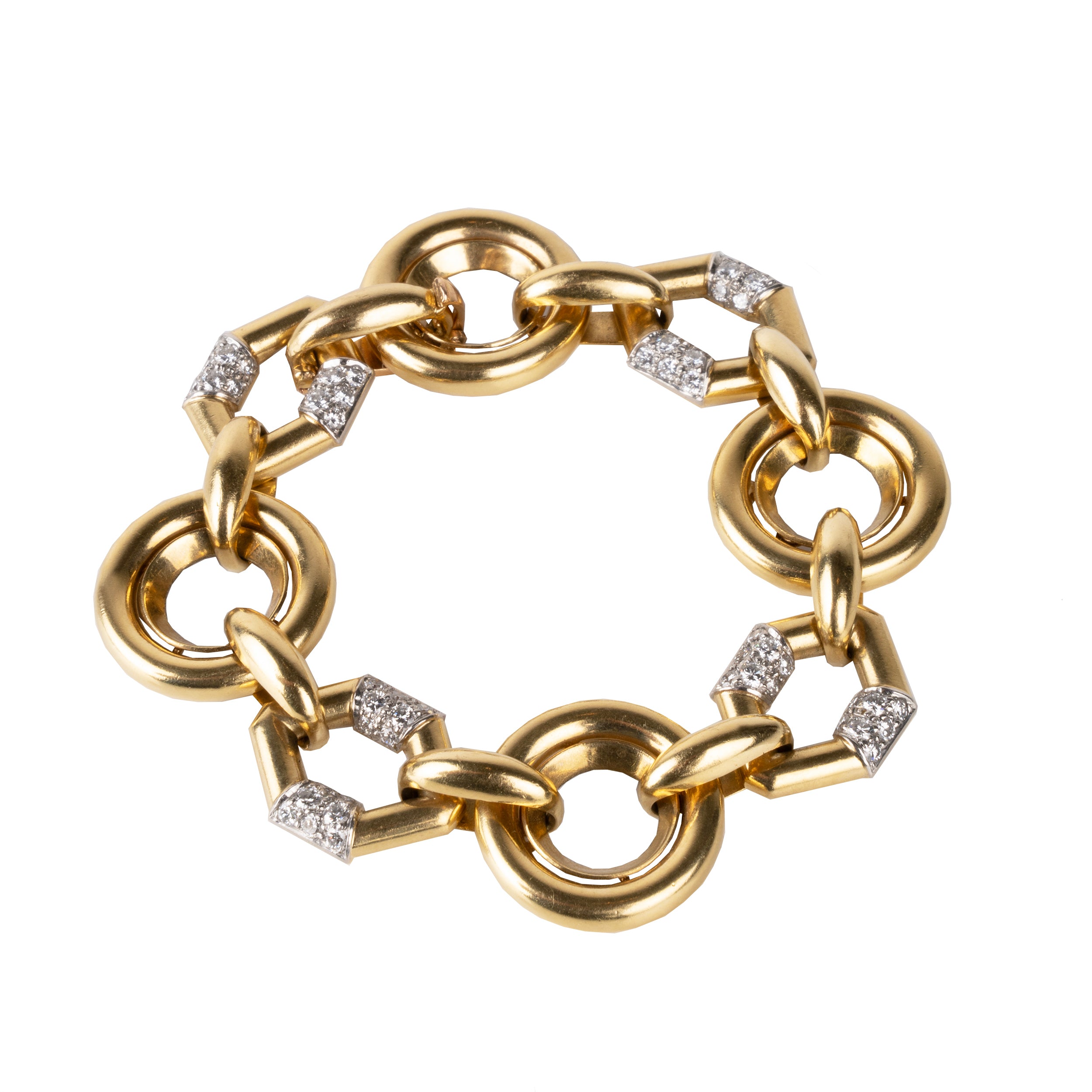Vintage Boucheron Diamond Linked Bracelet. An enduring linked design in 18k gold. Pavé set with approximately 2 carats of diamonds in platinum. Signed Boucheron, Paris. France, circa 1970.