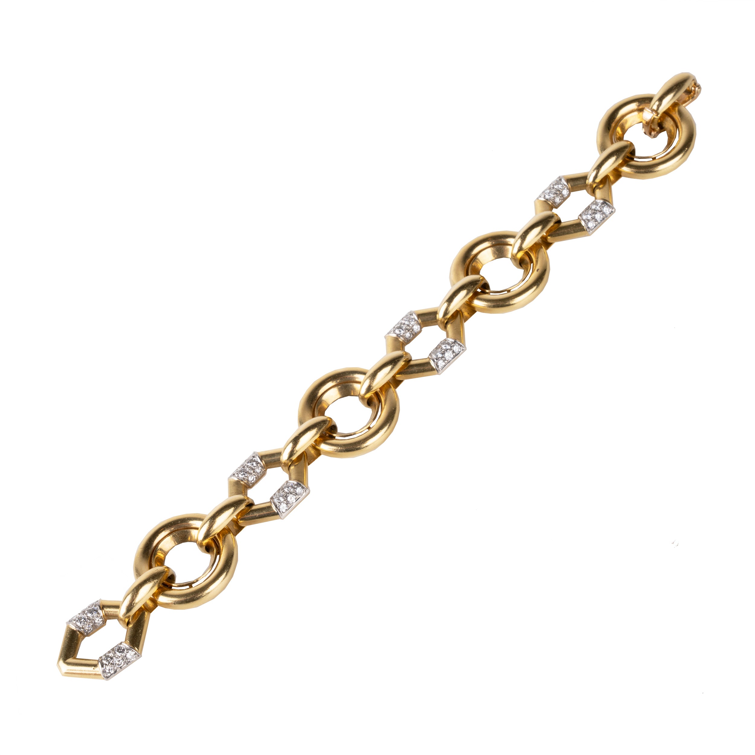 Vintage Boucheron Diamond Linked Bracelet. An enduring linked design in 18k gold. Pavé set with approximately 2 carats of diamonds in platinum. Signed Boucheron, Paris. France, circa 1970.