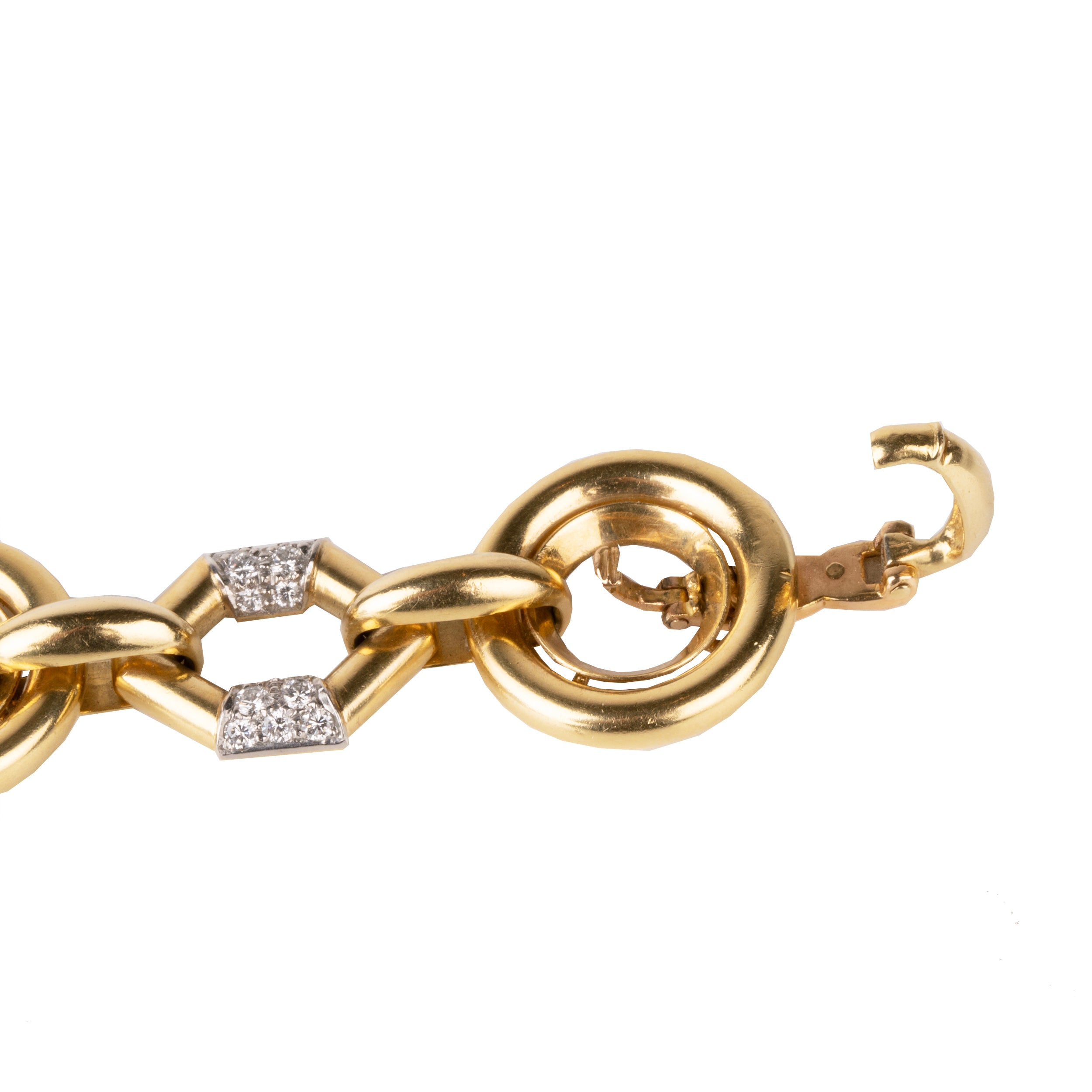 Vintage Boucheron Diamond Linked Bracelet. An enduring linked design in 18k gold. Pavé set with approximately 2 carats of diamonds in platinum. Signed Boucheron, Paris. France, circa 1970.