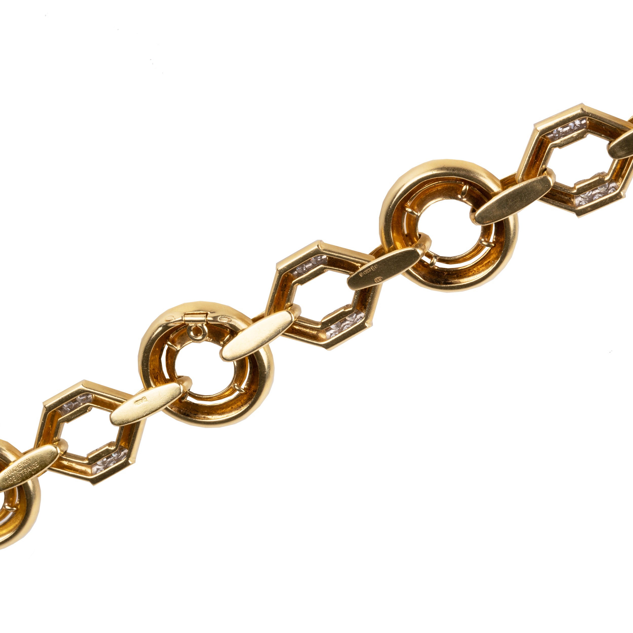 Vintage Boucheron Diamond Linked Bracelet. An enduring linked design in 18k gold. Pavé set with approximately 2 carats of diamonds in platinum. Signed Boucheron, Paris. France, circa 1970.