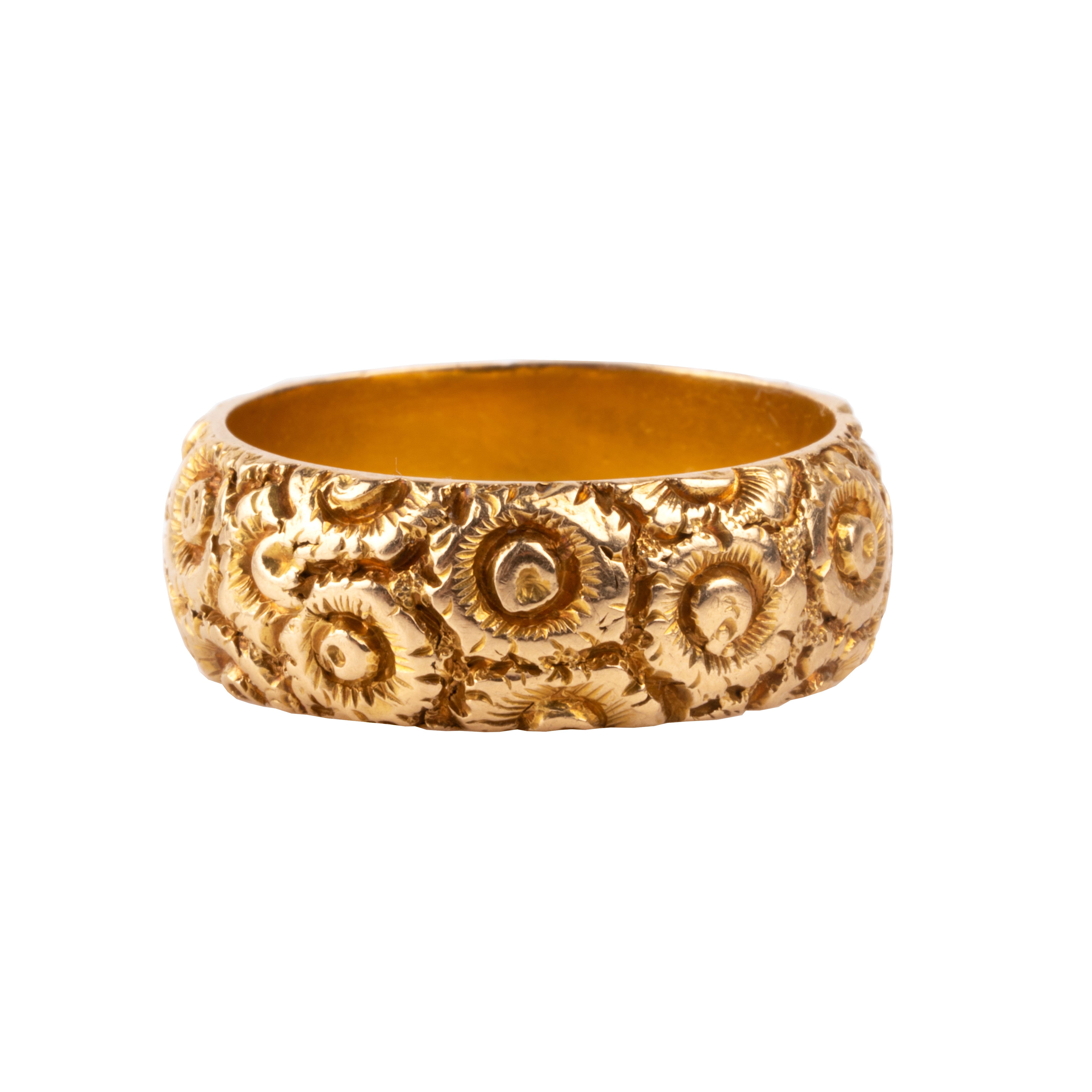 A substantial 18k gold band dating to the 19th century. There are deeply engraved flowers encircling the entire ring. Hallmarks for Chester, England, 1885. Side View.