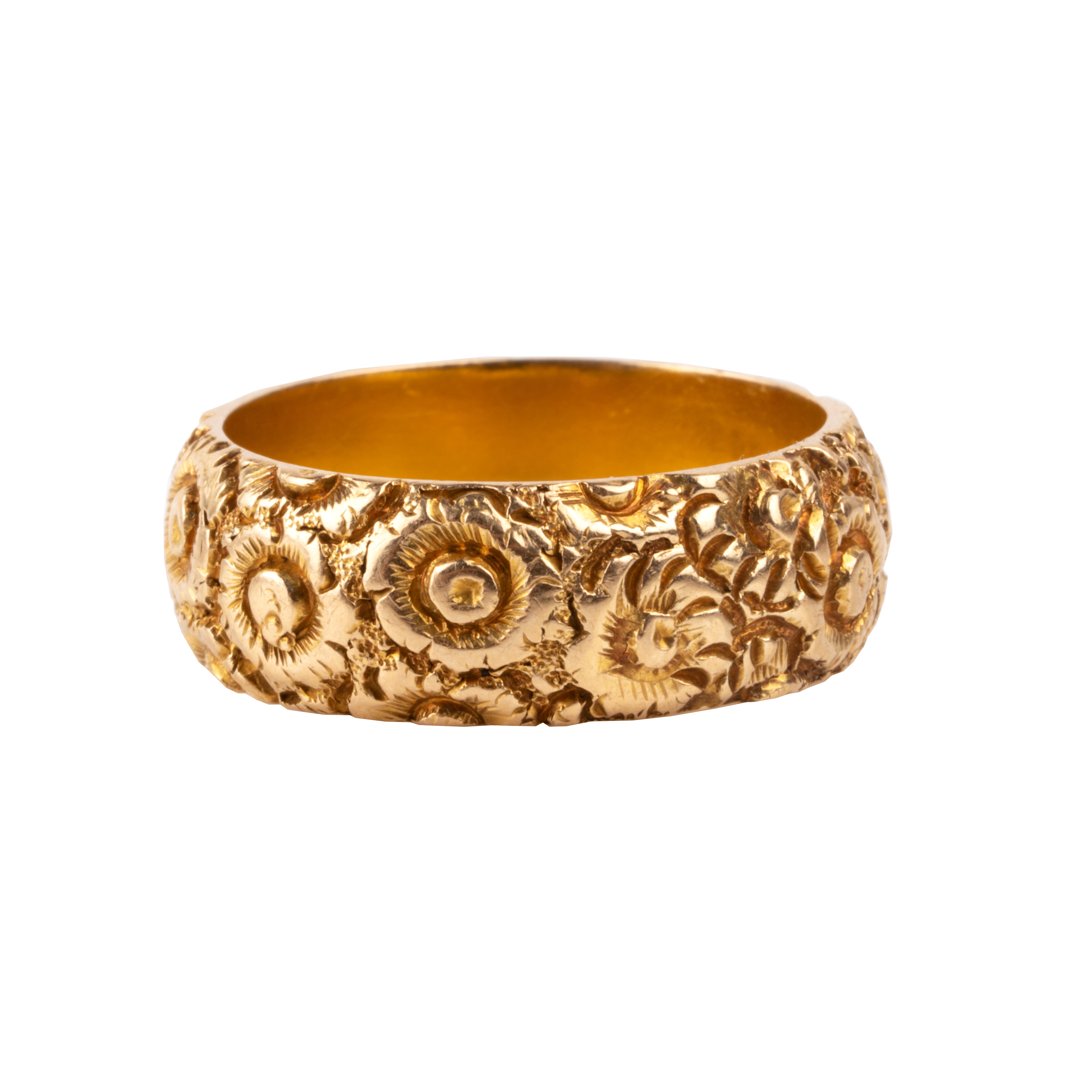 A substantial 18k gold band dating to the 19th century. There are deeply engraved flowers encircling the entire ring. Hallmarks for Chester, England, 1885. Side View.