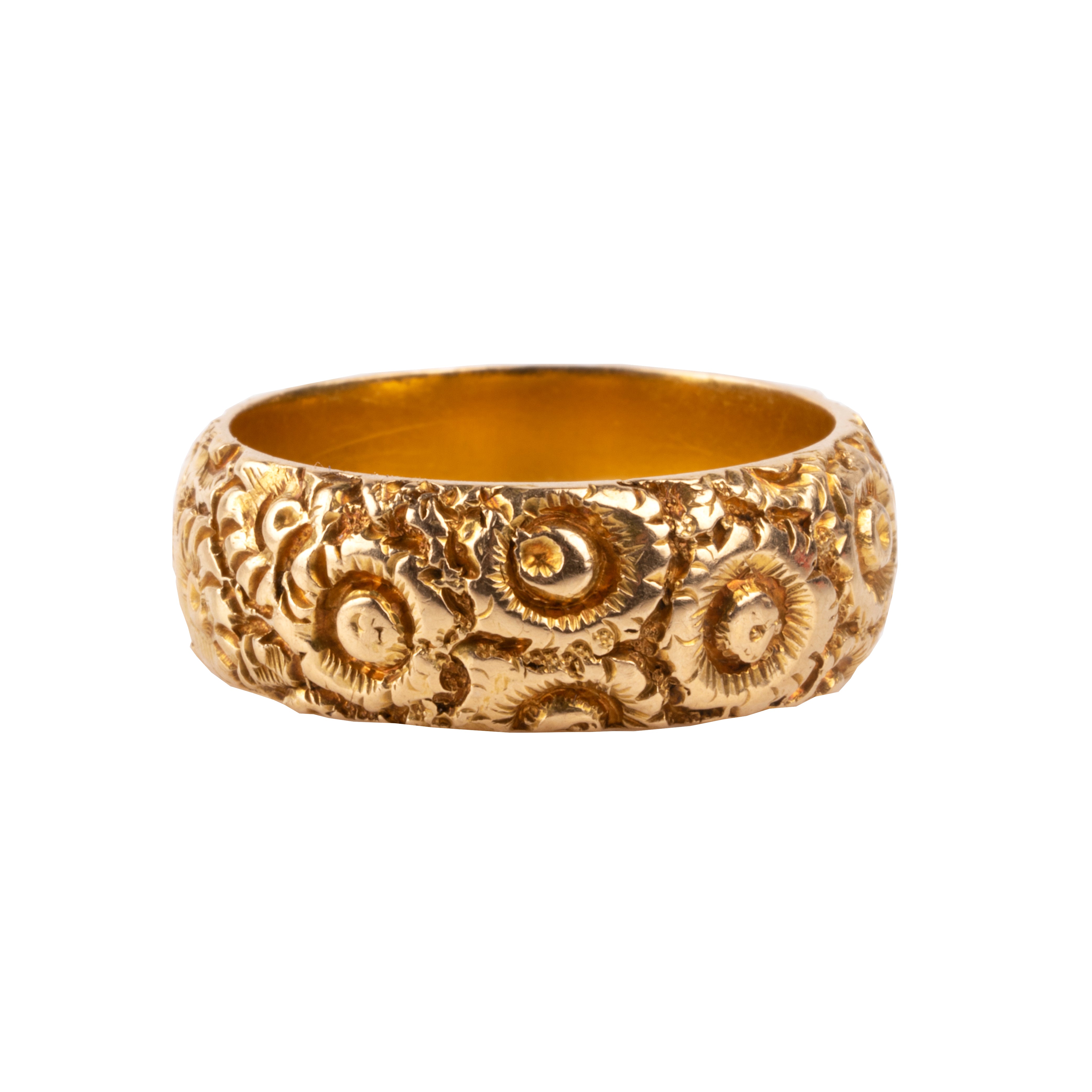 A substantial 18k gold band dating to the 19th century. There are deeply engraved flowers encircling the entire ring. Hallmarks for Chester, England, 1885. Side View.
