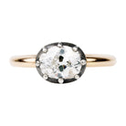 One of our signature designs, in silver-topped 18k gold. This design s inspired by a labor-intensive setting technique common in 18th and 19th-century rings. The silver-on-gold technique is true to the rings that inspired this design and is rarely seen in modern jewelry. This features a GIA certified cushion cut diamond 1.43 carat, I color and VS2 clarity. Front view.