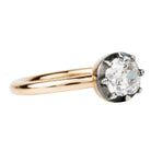 One of our signature designs, in silver-topped 18k gold. This design s inspired by a labor-intensive setting technique common in 18th and 19th-century rings. The silver-on-gold technique is true to the rings that inspired this design and is rarely seen in modern jewelry. This features a GIA certified cushion cut diamond 1.43 carat, I color and VS2 clarity. Side View.