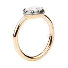 One of our signature designs, in silver-topped 18k gold. This design s inspired by a labor-intensive setting technique common in 18th and 19th-century rings. The silver-on-gold technique is true to the rings that inspired this design and is rarely seen in modern jewelry. This features a GIA certified cushion cut diamond 1.43 carat, I color and VS2 clarity. Profile view.