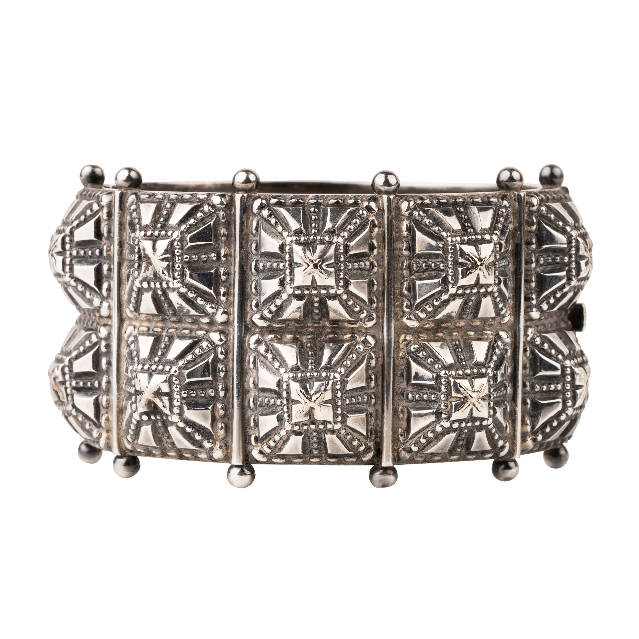 Victorian era wide sterling silver hobnail studded bangle. A bangle like this would have been the daytime jewel of choice for a well-appointed English woman of the 1870s and 80's. English in origin. Circa 1880.