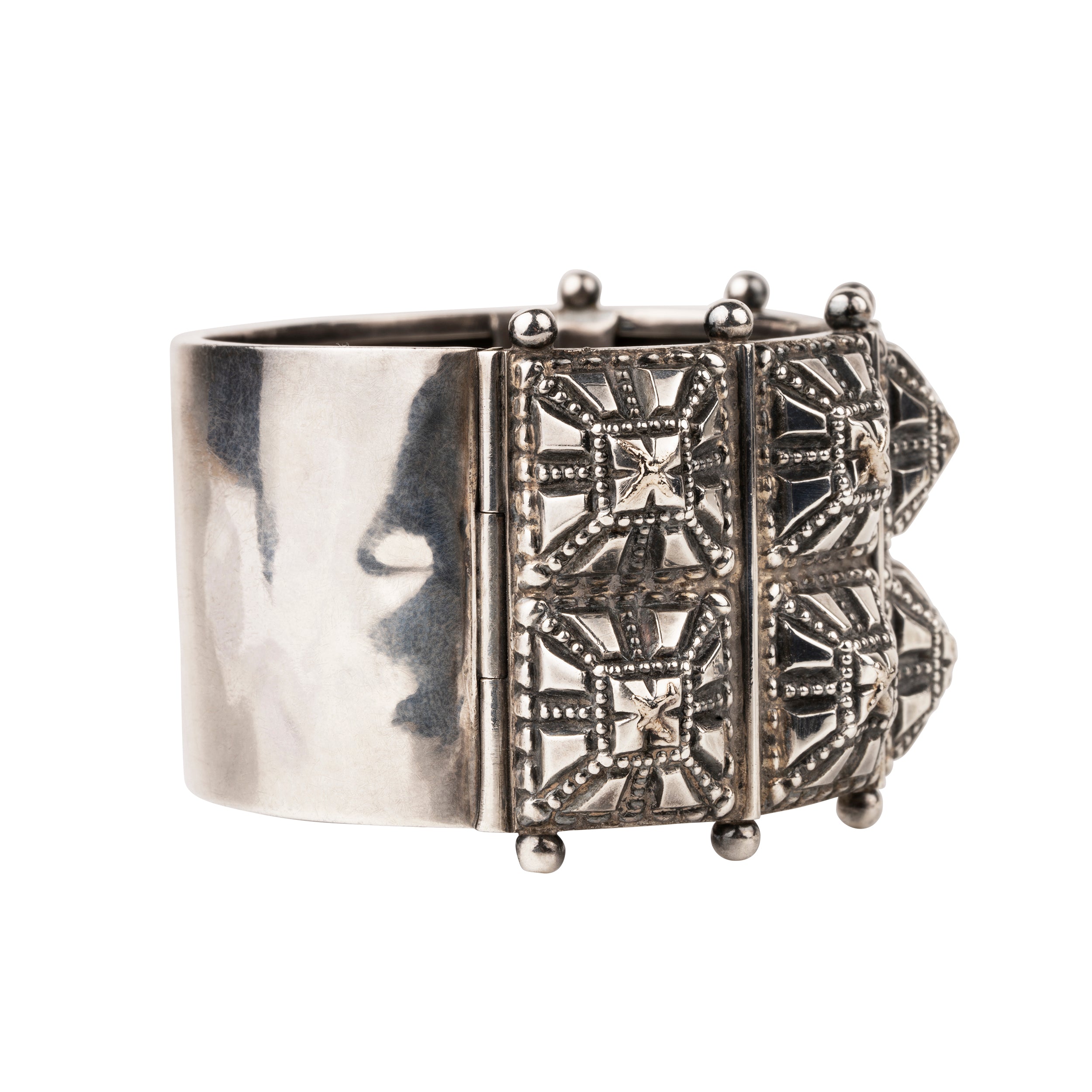 Victorian era wide sterling silver hobnail studded bangle. A bangle like this would have been the daytime jewel of choice for a well-appointed English woman of the 1870s and 80's. English in origin. Circa 1880.