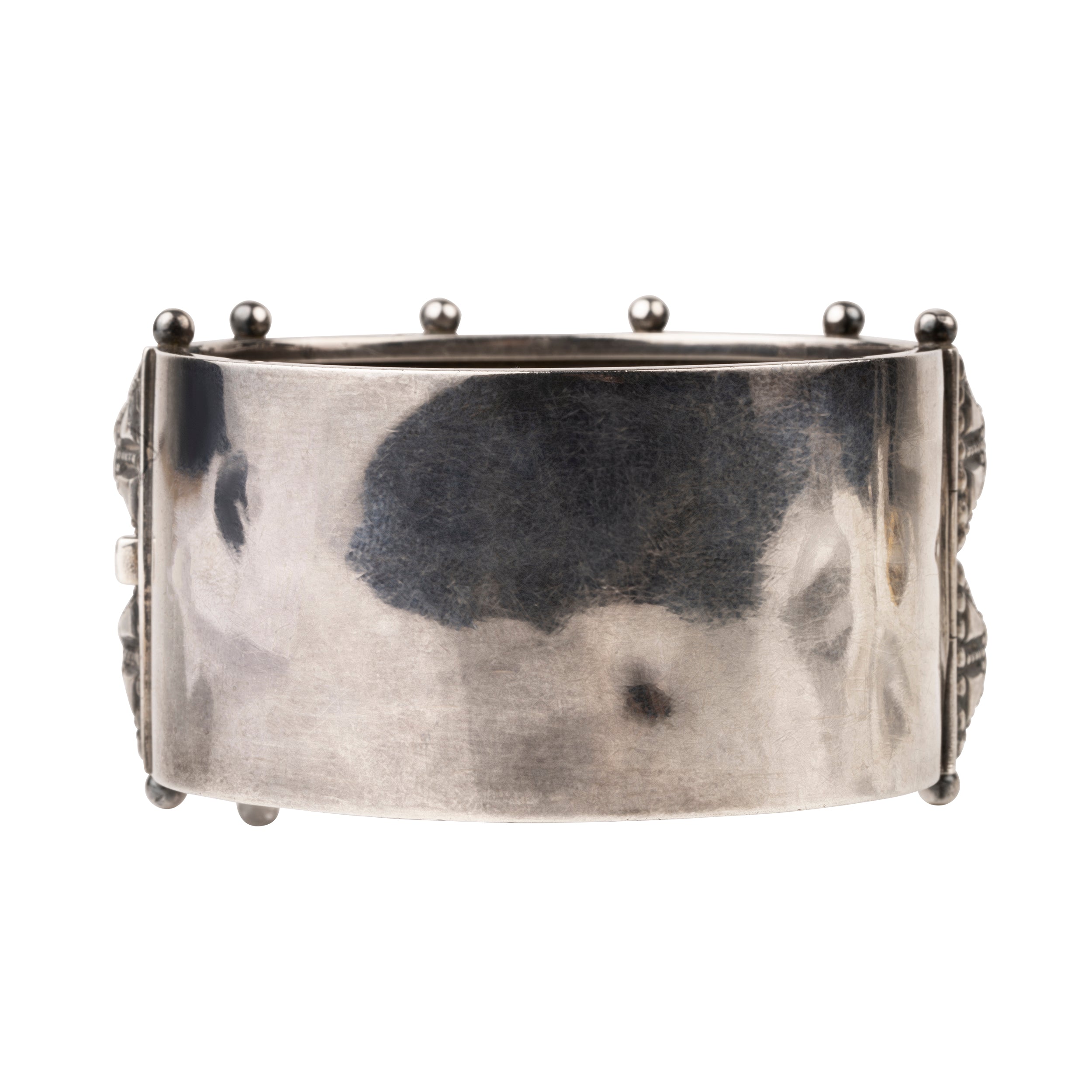 Victorian era wide sterling silver hobnail studded bangle. A bangle like this would have been the daytime jewel of choice for a well-appointed English woman of the 1870s and 80's. English in origin. Circa 1880.