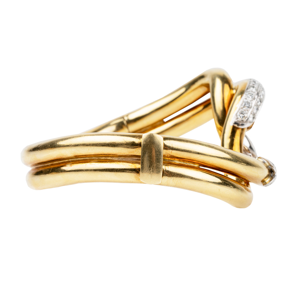 Finely crafted bangle in 18k gold and platinum set with 56 diamonds, approximated total weight 2.5 carats.American in origin. Circa 1970. Side View.