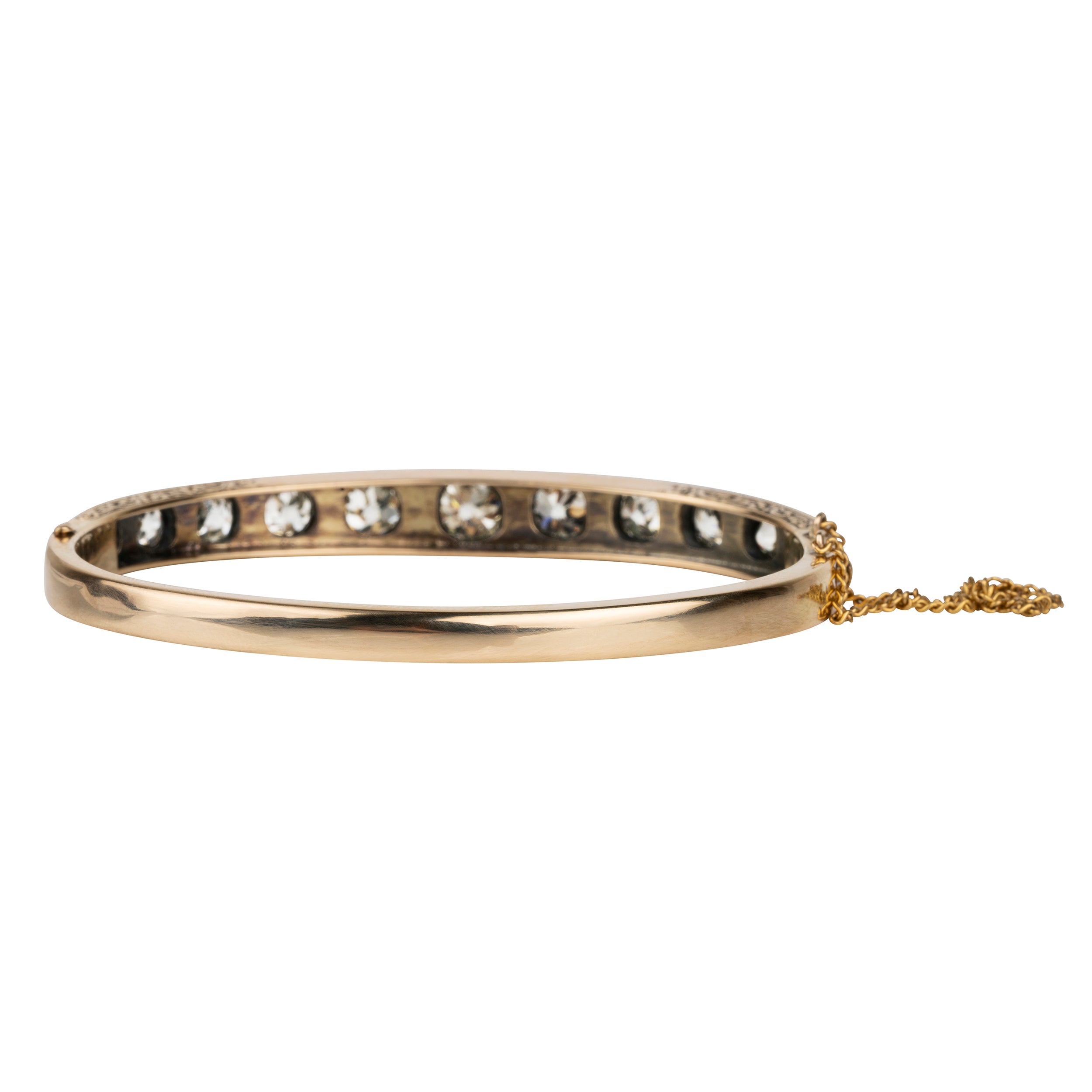 Victorian revival diamond bangle, in silver topped 15k gold. Eleven graduated old European cut diamonds, approximately 4 carats in total diamond weight. Found in Finland. European in origin. Circa 1920. 