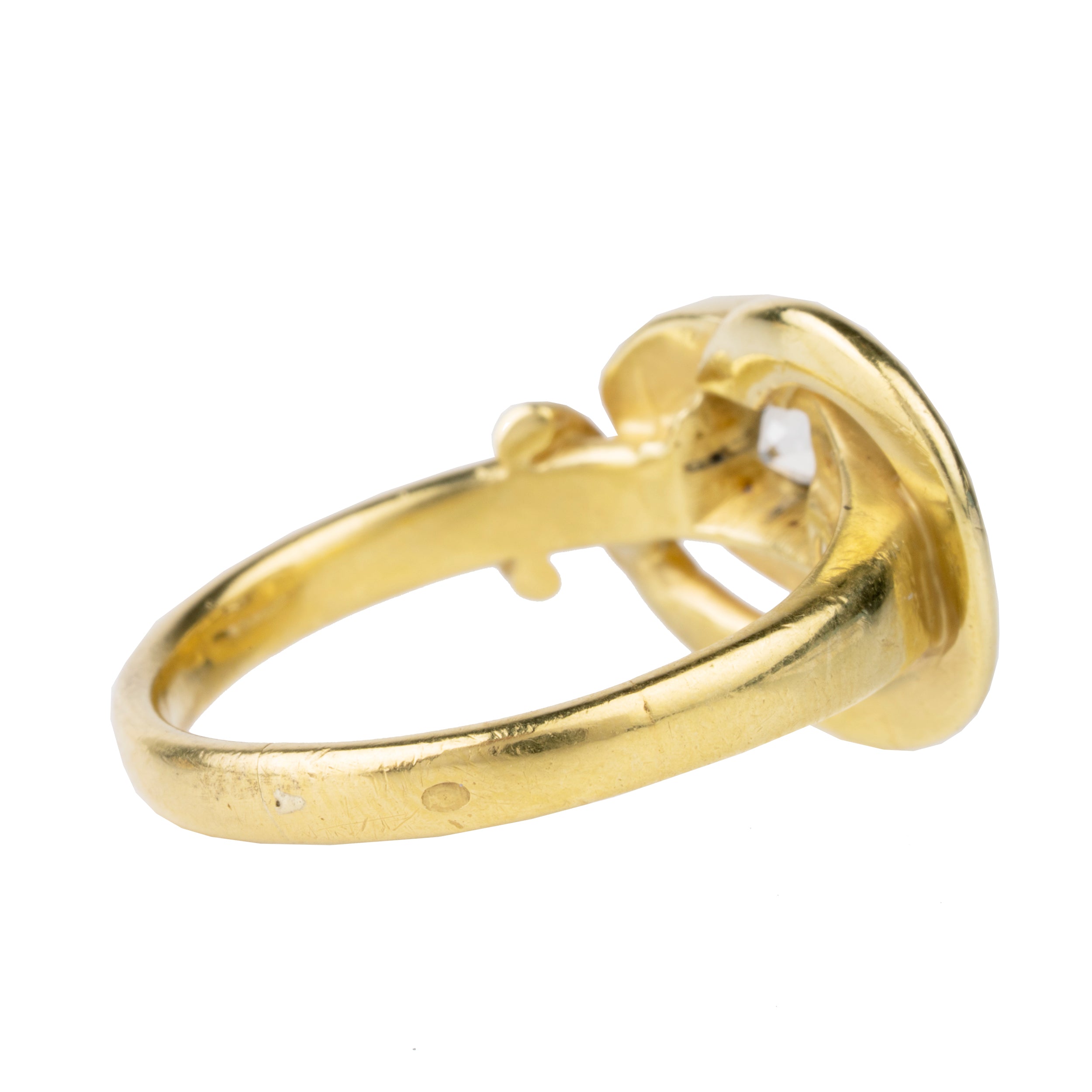 Victorian era diamond snake ring in 18k gold. An approximately 0.80 carat antique old European cut diamond in the head. English in origin. Circa 1890. Side view.