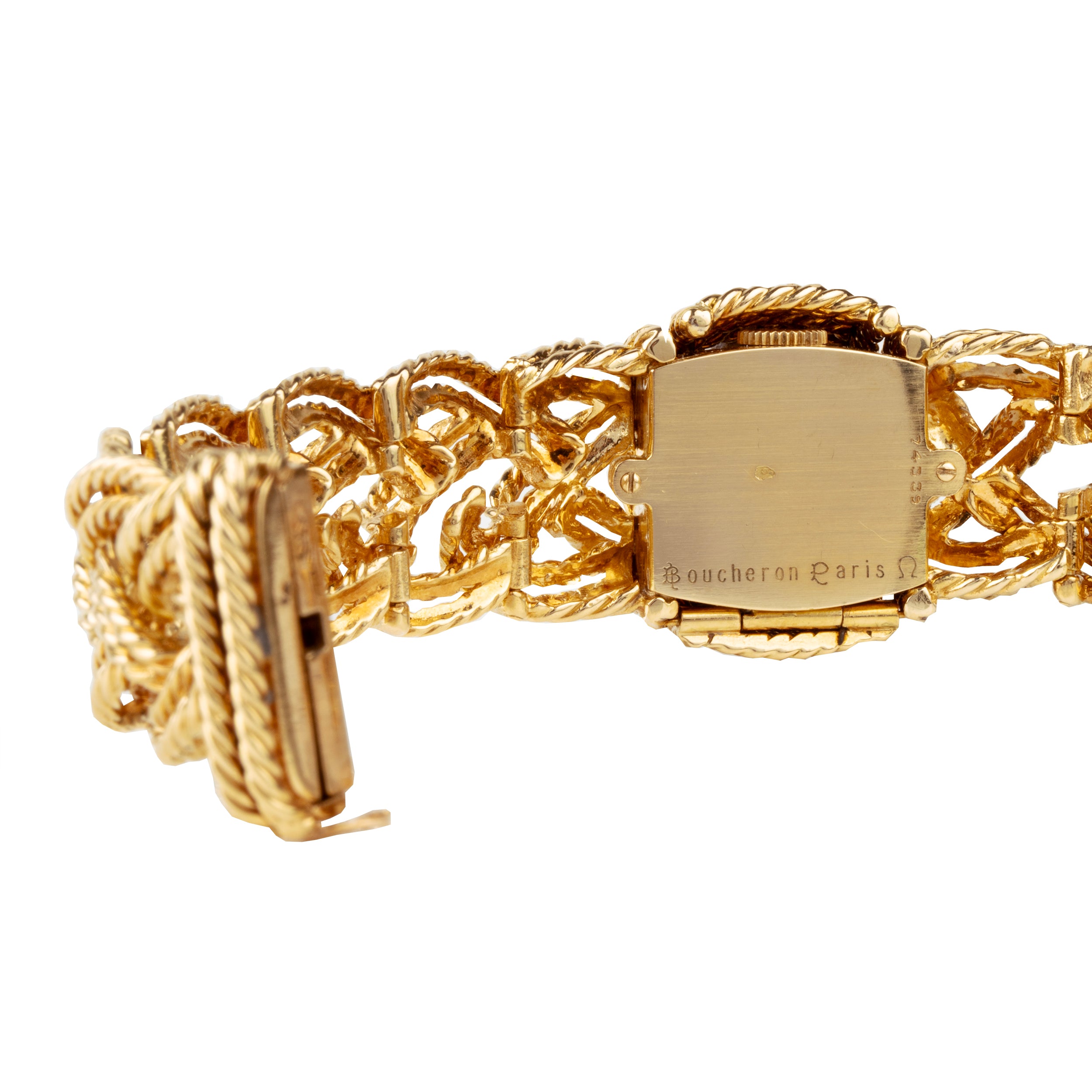 A braided 18k gold bracelet with a diamond panel that opens to reveal a diminutive watch face. The bracelet has an estimated diamond weight of 1.7 carats. Signed Boucheron, Paris. France, circa 1950.