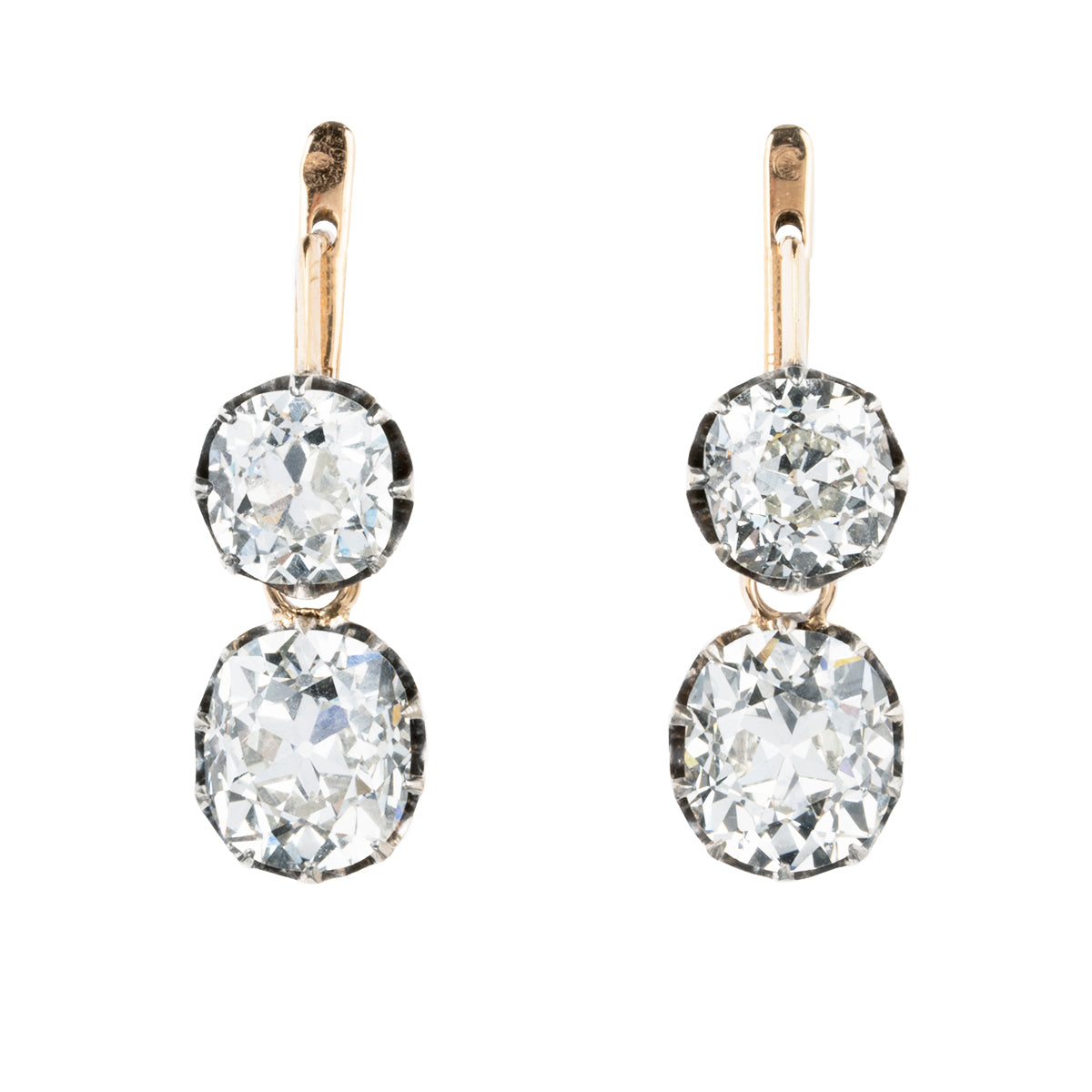 These earrings have an estimated nine carats in total weight. 4 cushion shaped, old mine cut diamonds are set in 14k gold and silver. The settings are arranged to allow a day-to-night function. The two smaller stones can be worn alone or with the larger drops. The smaller stones, weigh approx. 3 carats together. The two larger stones are certified by a French laboratory to be 2.87 carats, L color, and VS1 clarity and 2.96 carats, K color, VS1 clarity. European and French makers marks. Front view.