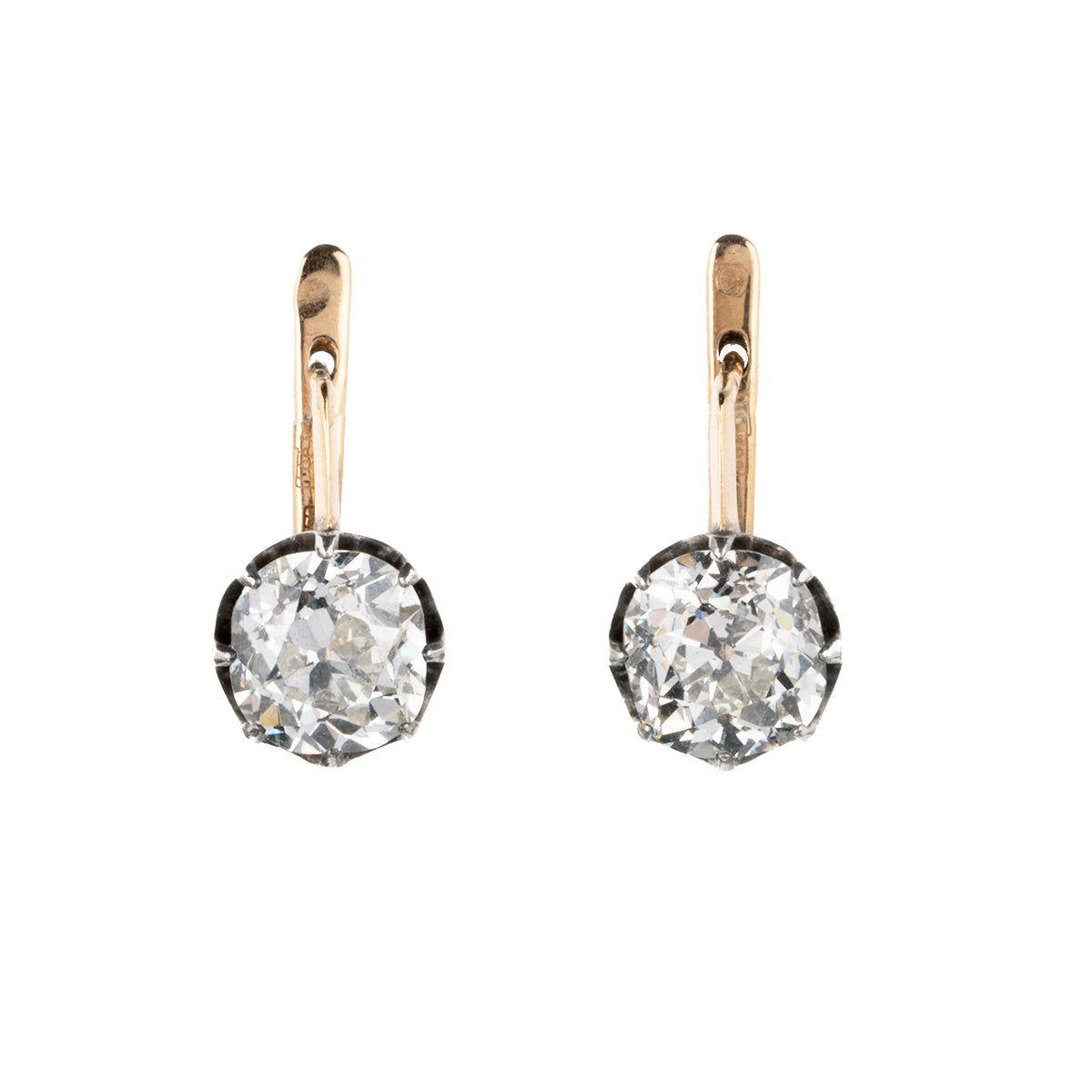 These earrings have an estimated nine carats in total weight. 4 cushion shaped, old mine cut diamonds are set in 14k gold and silver. The settings are arranged to allow a day-to-night function. The two smaller stones can be worn alone or with the larger drops. The smaller stones, weigh approx. 3 carats together. The two larger stones are certified by a French laboratory to be 2.87 carats, L color, and VS1 clarity and 2.96 carats, K color, VS1 clarity. European and French makers marks. Just the tops view.