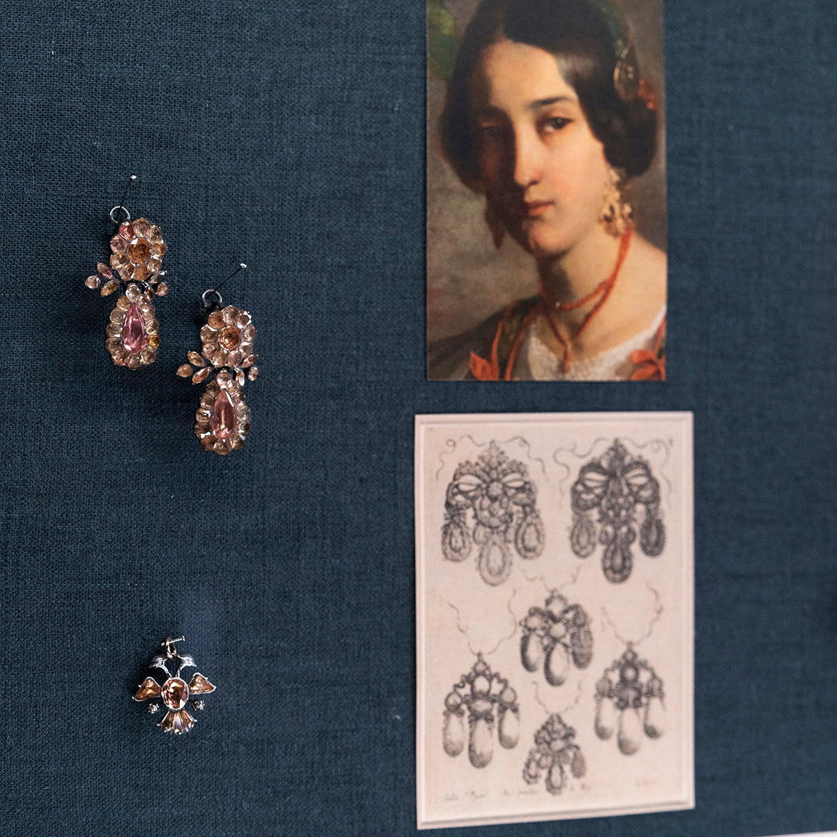 View of antique topaz earrings in our jewelry cases.