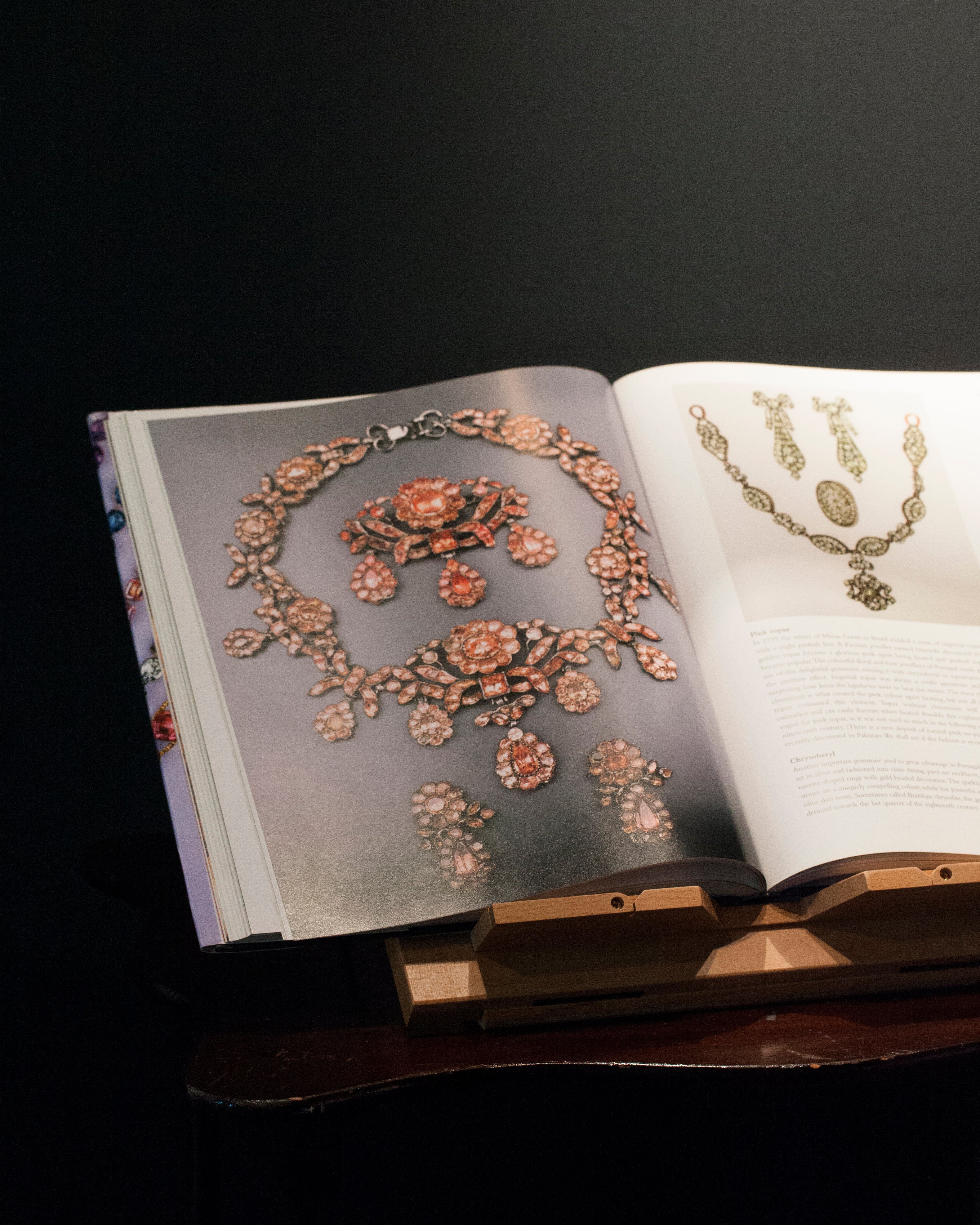 Photo of an open book displaying antique earrings