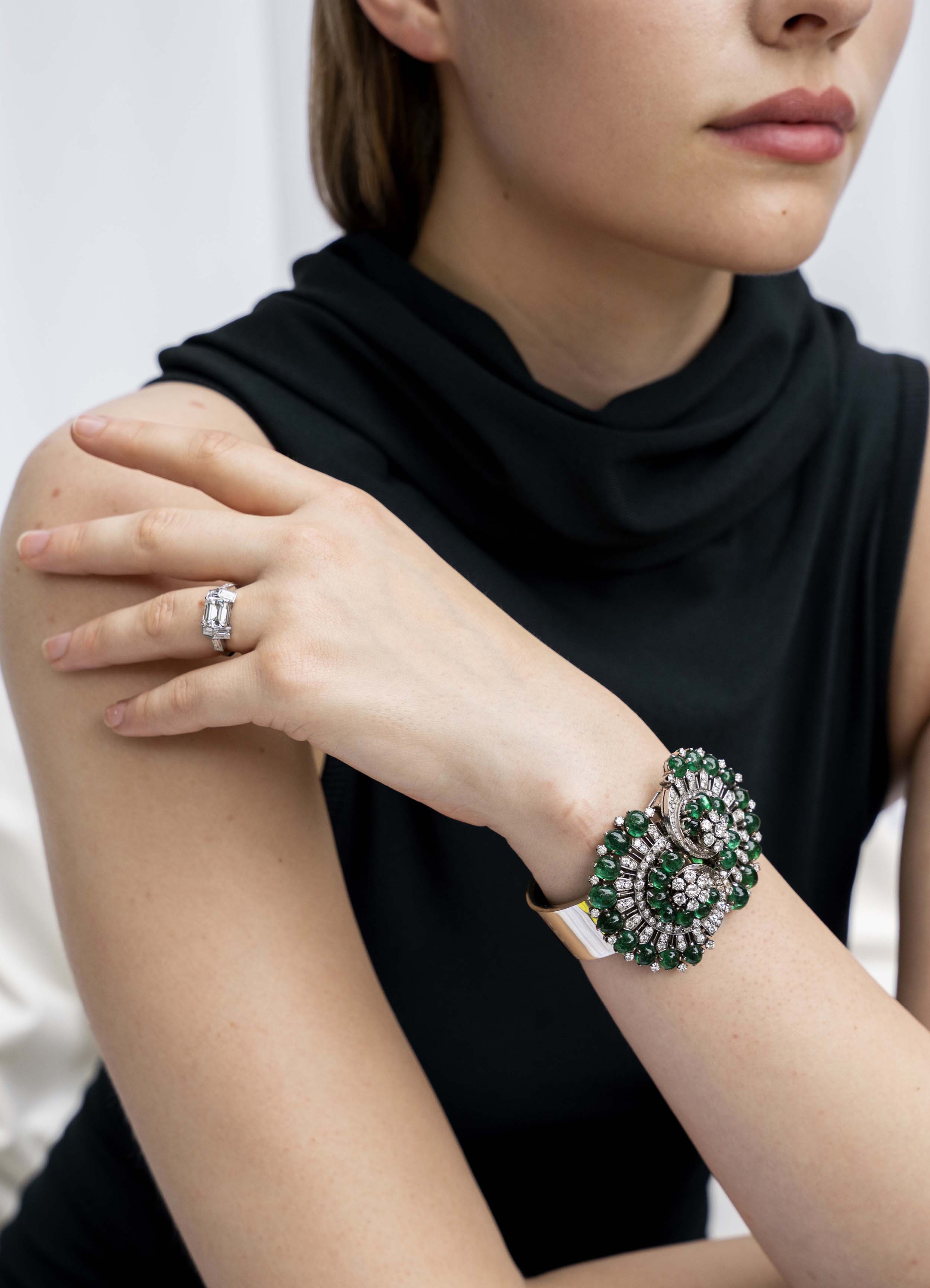 A contemporary design constructed a seven-stone ring with classical techniques. Six baguette diamonds surround an emerald cut diamond. This ring features a GIA-certified emerald cut diamond, 2.01 carats, H color, and VS1 clarity. There are six vintage baguette diamonds, approximately 1.12 carats in total diamond weight, H color, and VS2 clarity. Handcrafted in platinum.