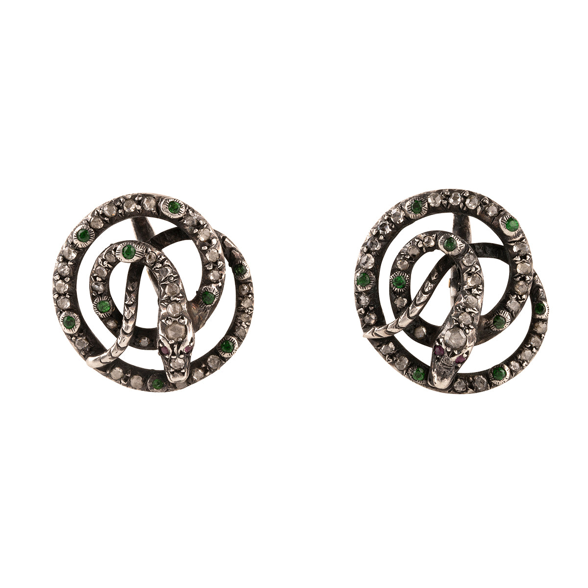 Georgian era diamond and emerald coiled snake earrings, set in silver. A mixture of rose cut diamonds and emeralds on the body and rubies for eyes. Continental Europe. Circa 1790. Front View.