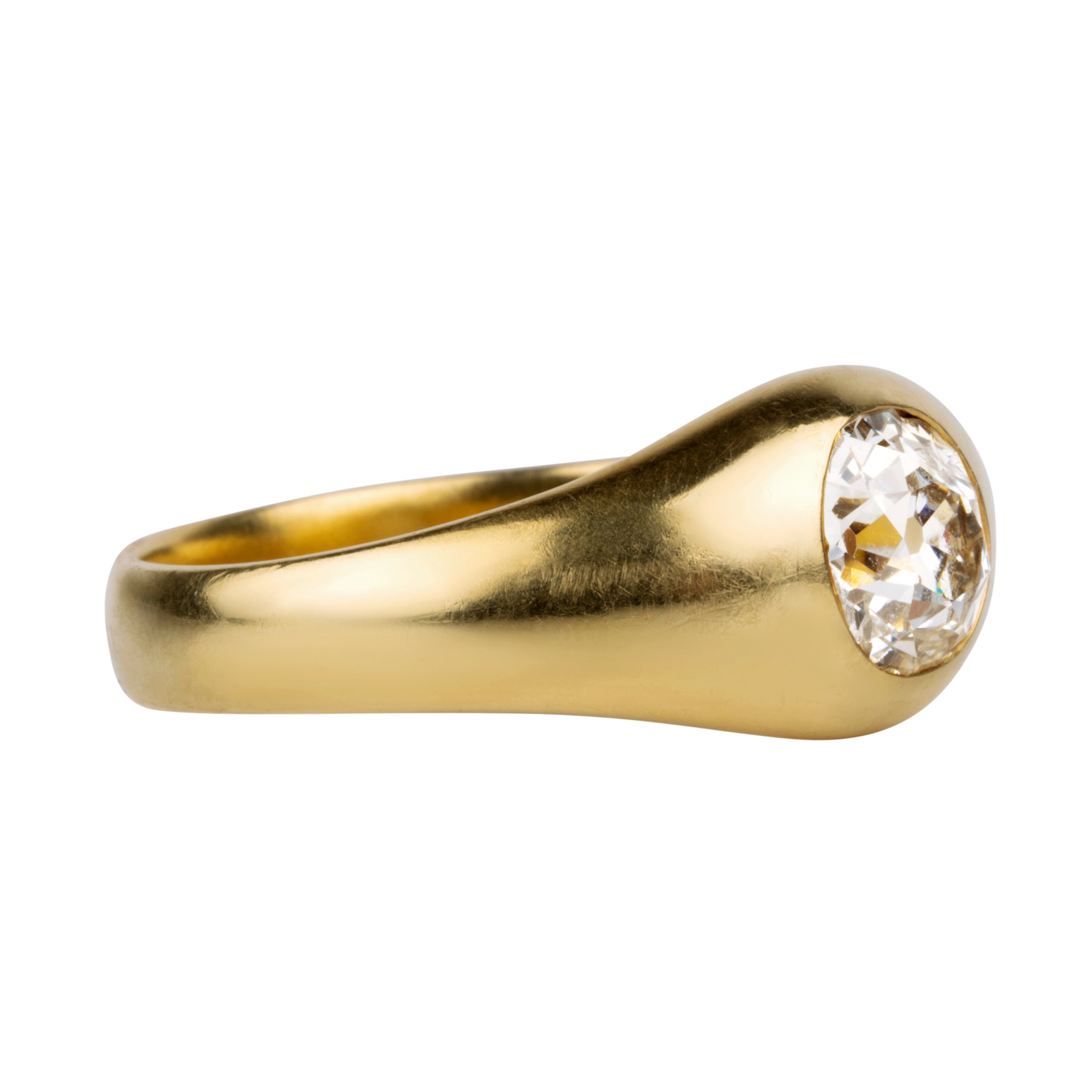 Victorian era flush set diamond solitaire ring. A lovely heavy 18k yellow gold with a single old mine cut diamond approx 1.25 cts, H color. American in origin. Circa 1890. Side view.