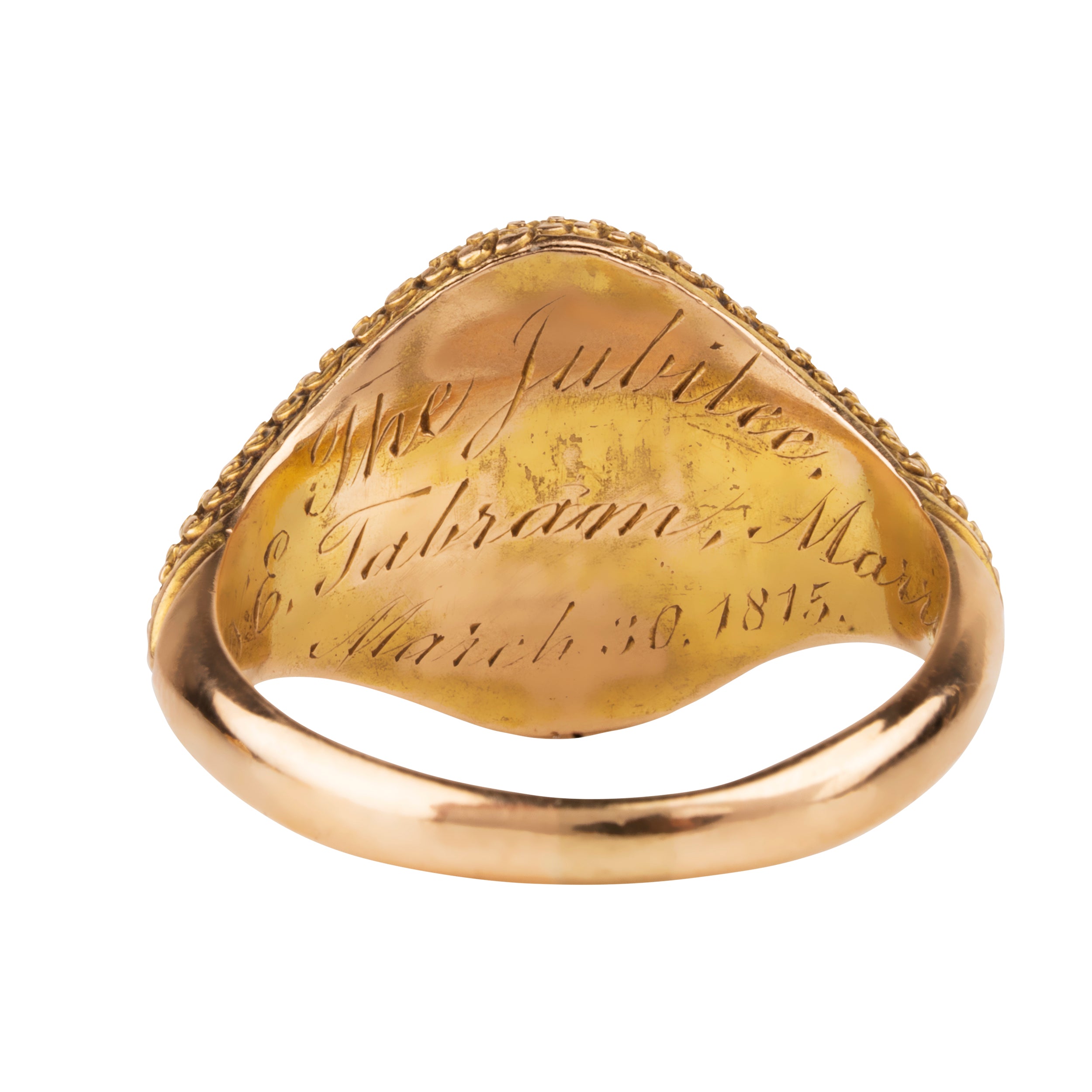 Victorian era garnet cabochon signet ring in 18k gold. Hand engraved "The Jubilee, LC& E, Tabram, Married March 30, 1815." English in origin. Likely made in 1865 celebrating a 50th wedding anniversary. Back view of the hand engraving details.