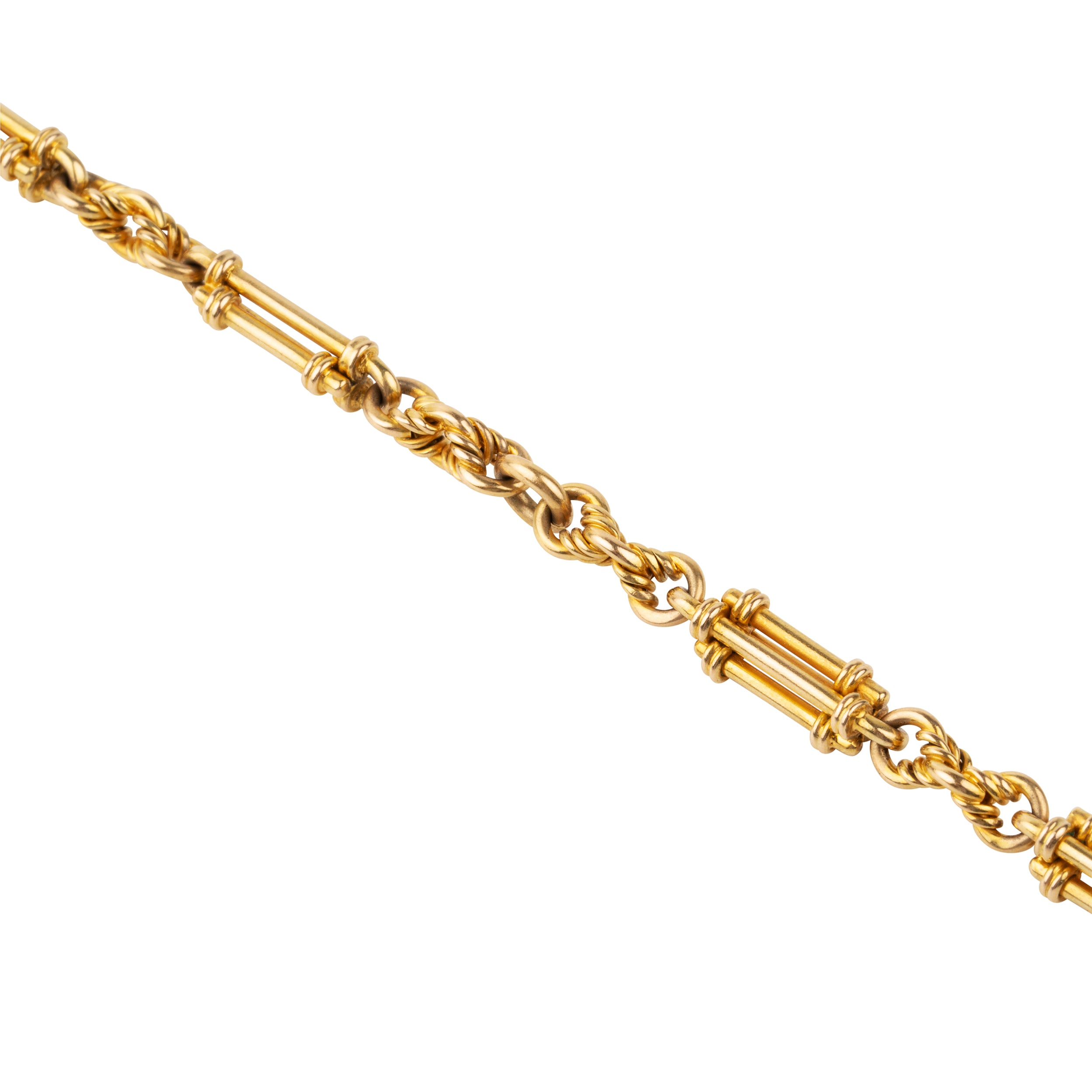 A petite but intricate watch chain bracelet. A deep yellow 18k gold is formed in bar and twisted links. Originally part of a 19th-century watch chain, this piece is robust enough to wear every day and be an addition to a bracelet stack or worn alone.While the bracelet is not bulky, there is still a nice weight to it as each element is solid. There is one bar element that has been lost with time, pictured.England. Circa 1870.