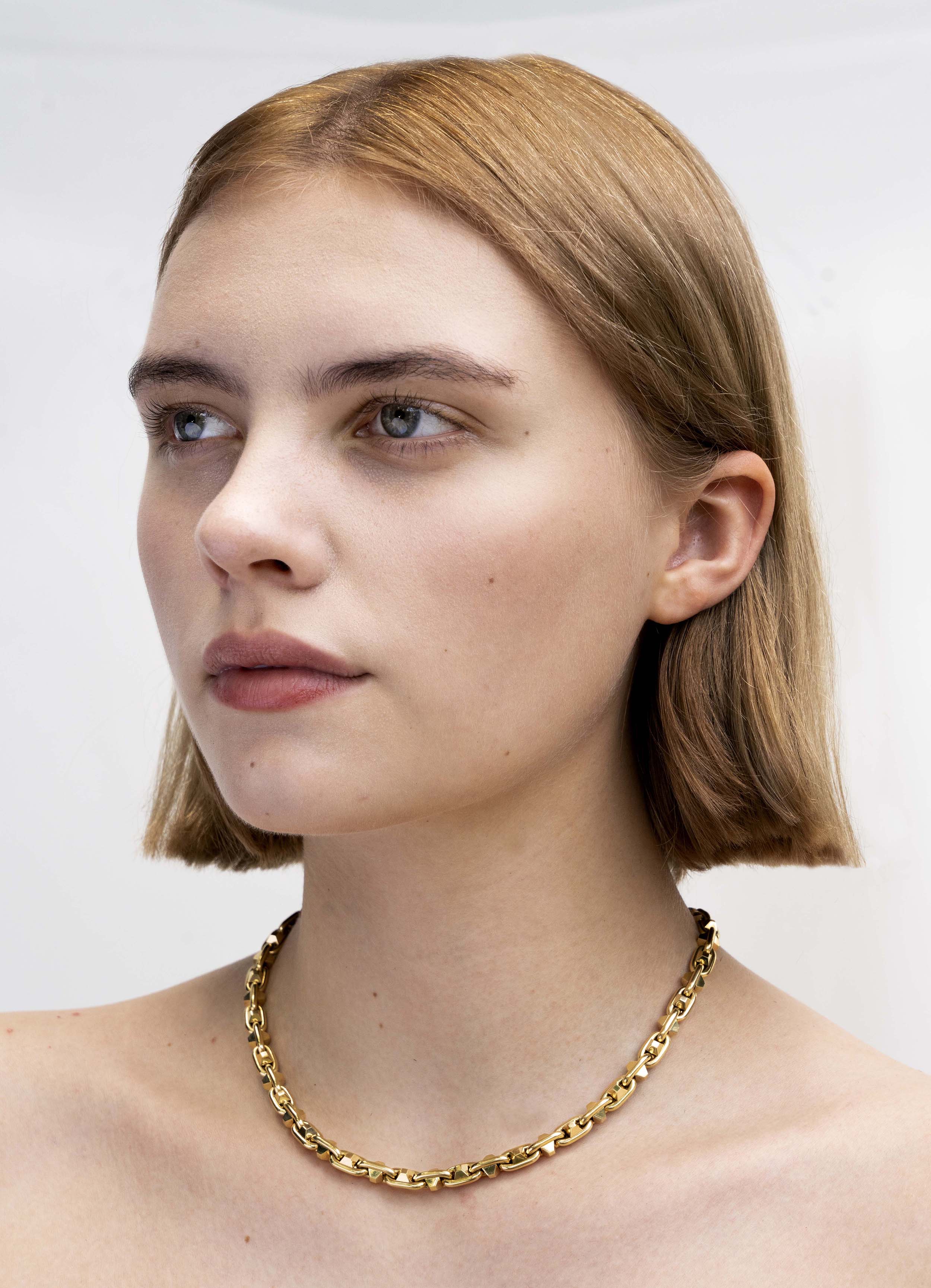 Bell & Bird Yellow Gold Hobnail Necklace. Handmade in 18k yellow gold. 17" in length. The necklace being modeled.