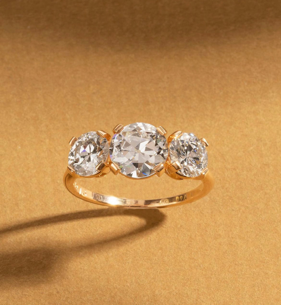 Bell and Bird Three Stone Diamond Ring