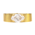 Oversize solitaire setting inspired by the ancient Roman high carat gold stir-up shaped rings we have handled. The tab prongs setting allows for a minimal yet bold setting. This ring features a moval cut diamond of 2.05 carats, F color and VS1 clarity. Made in our custom 18k yellow gold with a subtle soft finished polish.