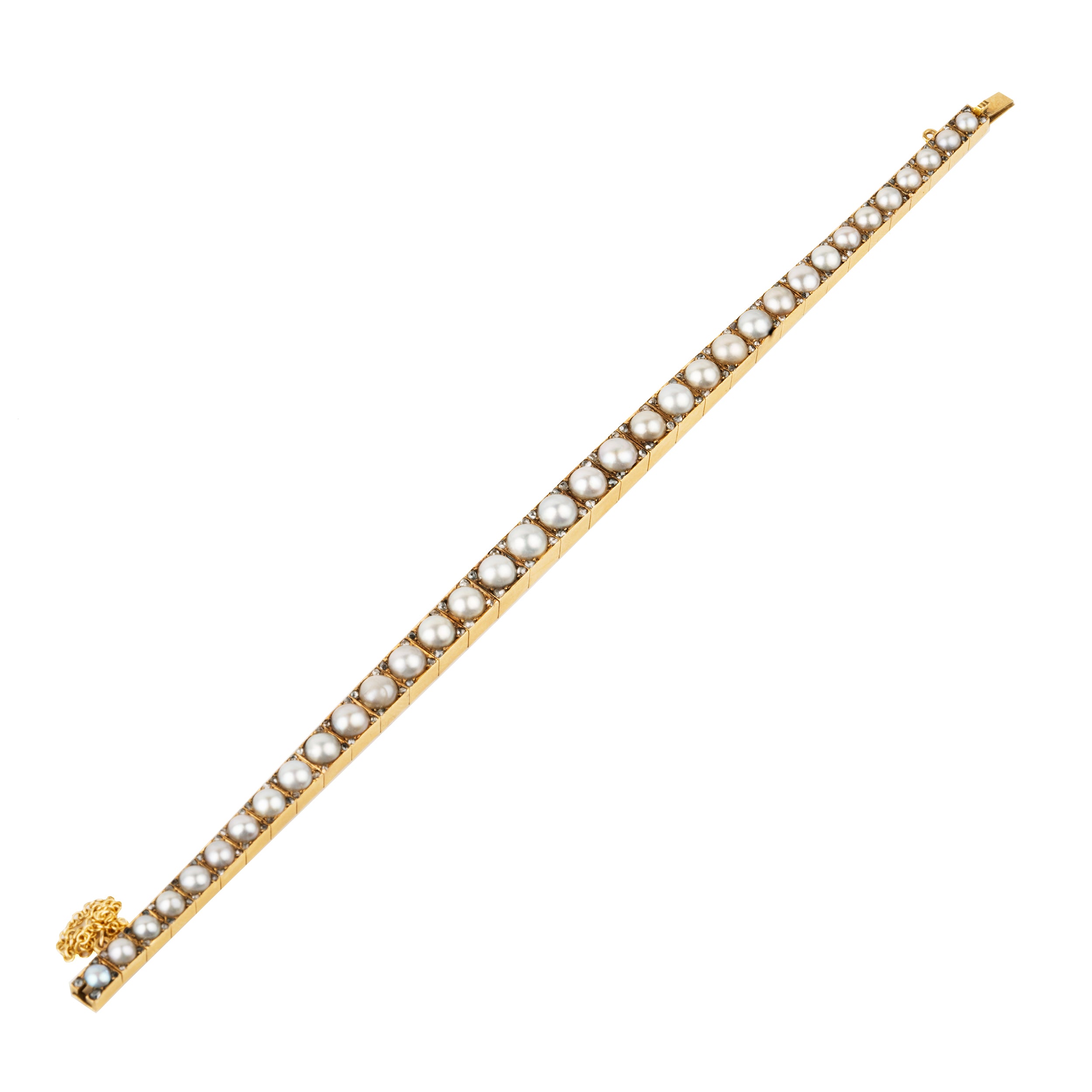 Edwardian era pearl and diamond line bracelet. White split pearls are set in 18k yellow gold. Each pearl is pointed with four rose cut diamonds in square settings. England, circa 1910. top view.