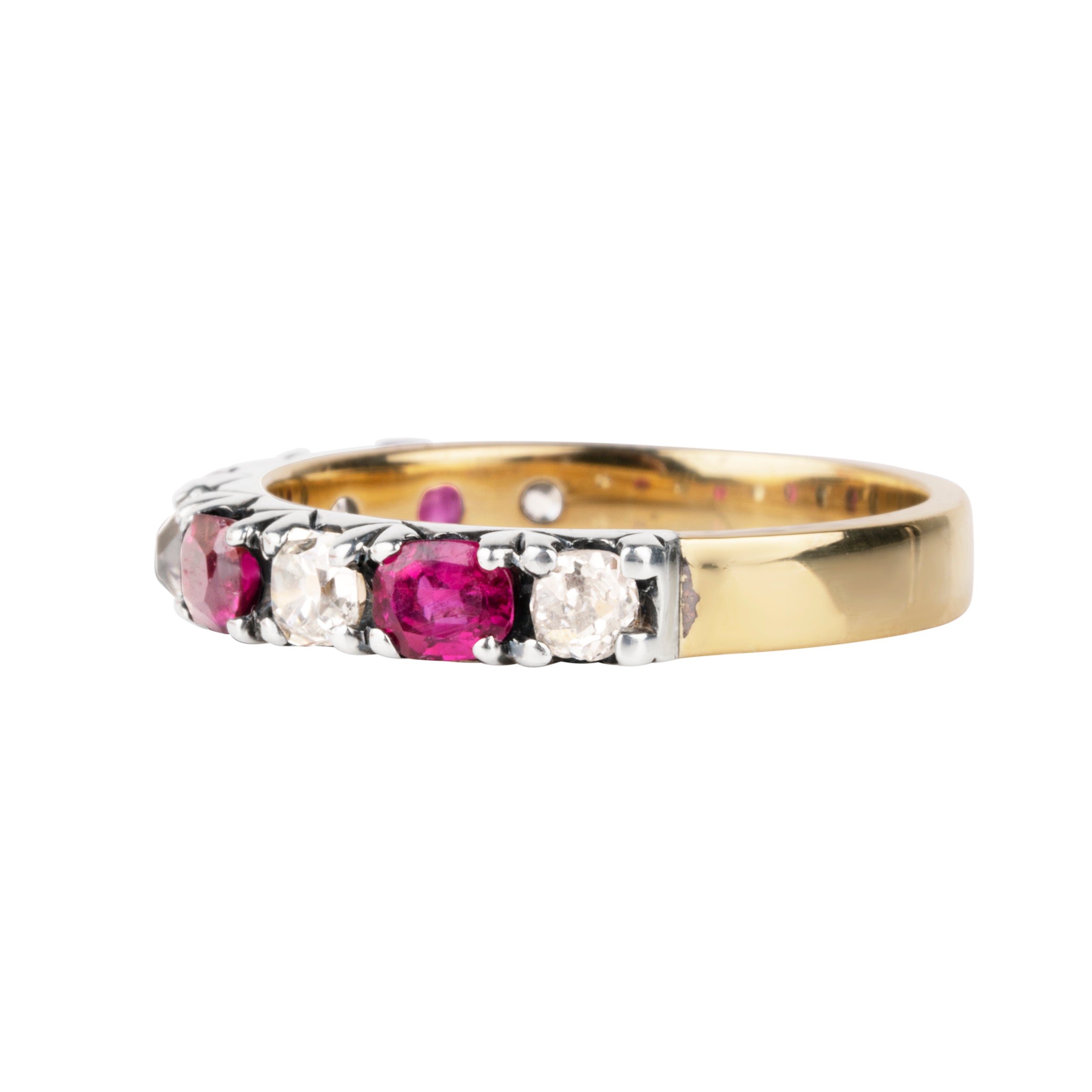 Georgian-inspired diamond and ruby ring, in silver topped with gold. Old mine cut diamonds and rubies set in a fishtail setting. English in origin. Circa 20th century. Side view.