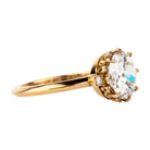 One of our signature Bell and Bird designs.This solitaire ring features a main round old European cut diamond surrounded by 8 single-cut diamonds subtly peeking out from underneath the main stone. There are two additional single-cut diamonds at the base of the whisper-thin, hand-filed knife edge band.Set in our 18k old gold. This ring features a GIA certified 2.27 carat I color and VS2 clarity old European cut diamond. Handcrafted in our 18k old gold.