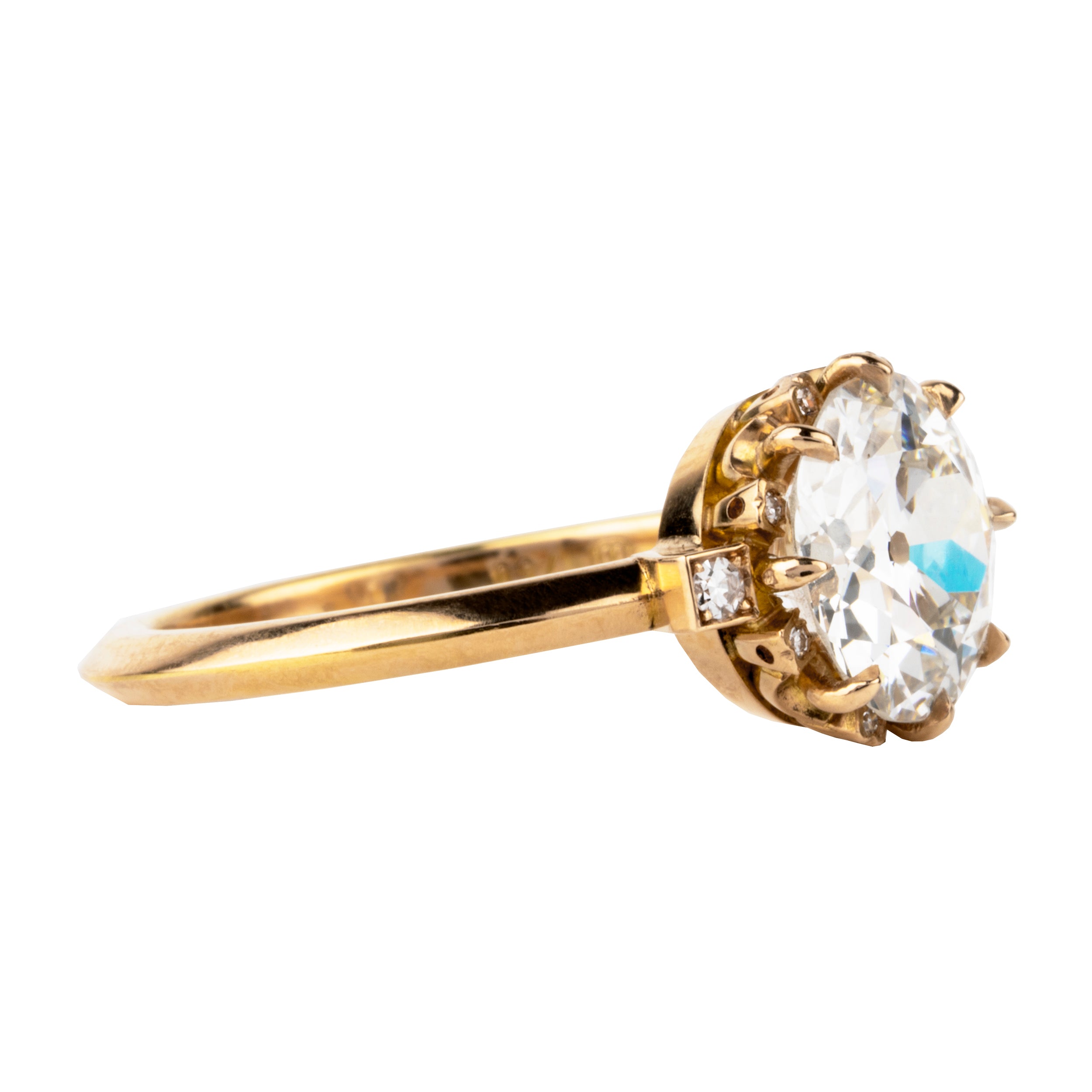 One of our signature Bell and Bird designs.This solitaire ring features a main round old European cut diamond surrounded by 8 single-cut diamonds subtly peeking out from underneath the main stone. There are two additional single-cut diamonds at the base of the whisper-thin, hand-filed knife edge band.Set in our 18k old gold. This ring features a GIA certified 2.27 carat I color and VS2 clarity old European cut diamond. Handcrafted in our 18k old gold.