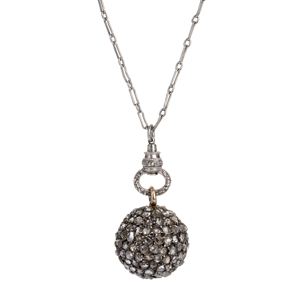 A rare Georgian-era diamond ball pendant is hanging on an early 20th century French platinum chain. Rose-cut diamonds are intricately pavé set in silver, gold, and platinum. The chain has French hallmarks and The ball is English in origin. Circa 1820. Close up front view.