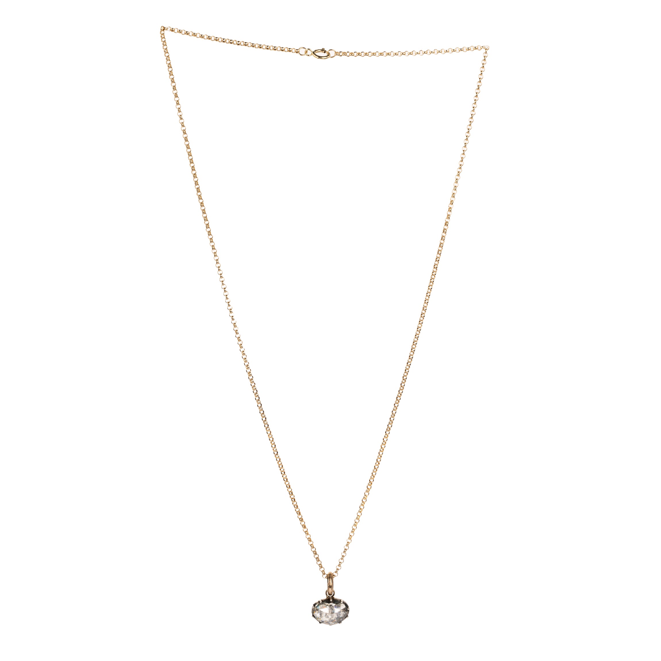 Georgian era rose cut diamond pendant necklace. The bright rose cut diamond is a subtle heart-shape, set in a foiled closed-back setting. Originally part of a larger piece of jewelry, it was later converted into a simple charm pendant. The diamond weighs approximately .95 carats. The diamond is quite flat and faces- up like a two-carat stone. Found in Paris. Circa 1820. Front view of the necklace. The diamond is hanging from a delicate gold chain.