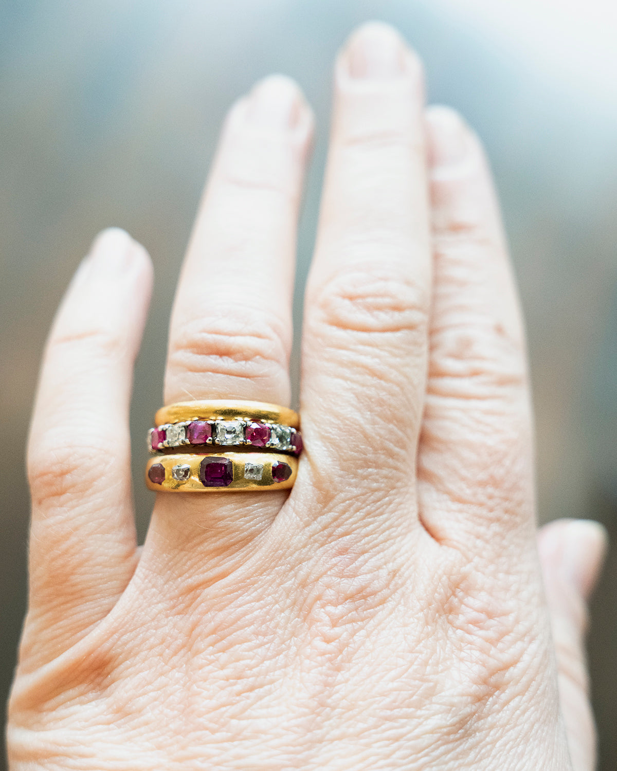 Victorian-era gypsy set ruby and diamond ring in 18k gold. A great mixture of high-crowned old mine cut diamonds with step-cut and shield-shaped rubies flush set. England, Circa 1880.