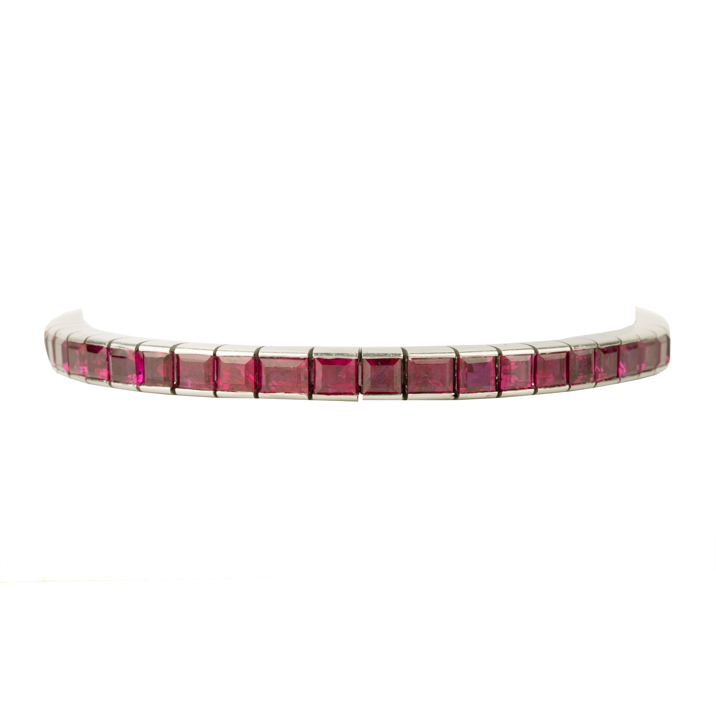 Art Deco ruby line bracelet. A fine early 20th-century platinum line bracelet. Natural deep red step-cut rubies are primarily Burmese in origin. Approximated at 11 carats in total stone weight. America, circa 1920. front view.