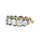 Gold ring with diamonds on a white background