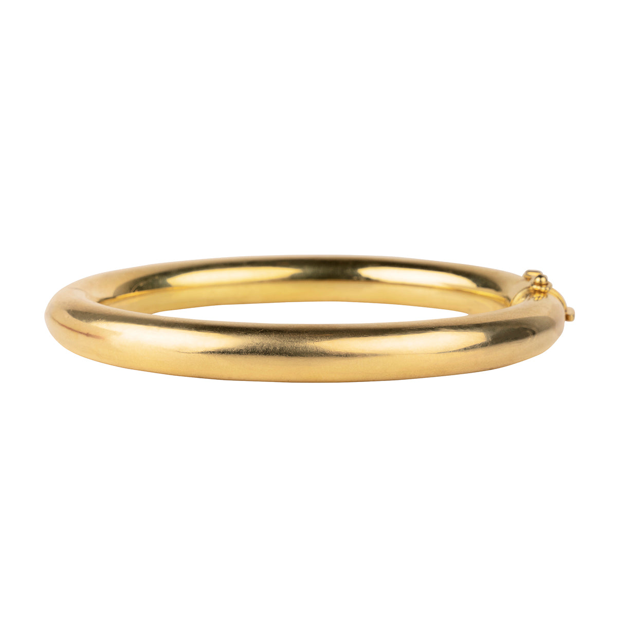 Turn-of-the-century gold tube bangle bracelet in 18k yellow gold. Rich yellow gold bracelets finely constructed with hidden push button clasps.French hallmarks. Circa 1900. Backside view.