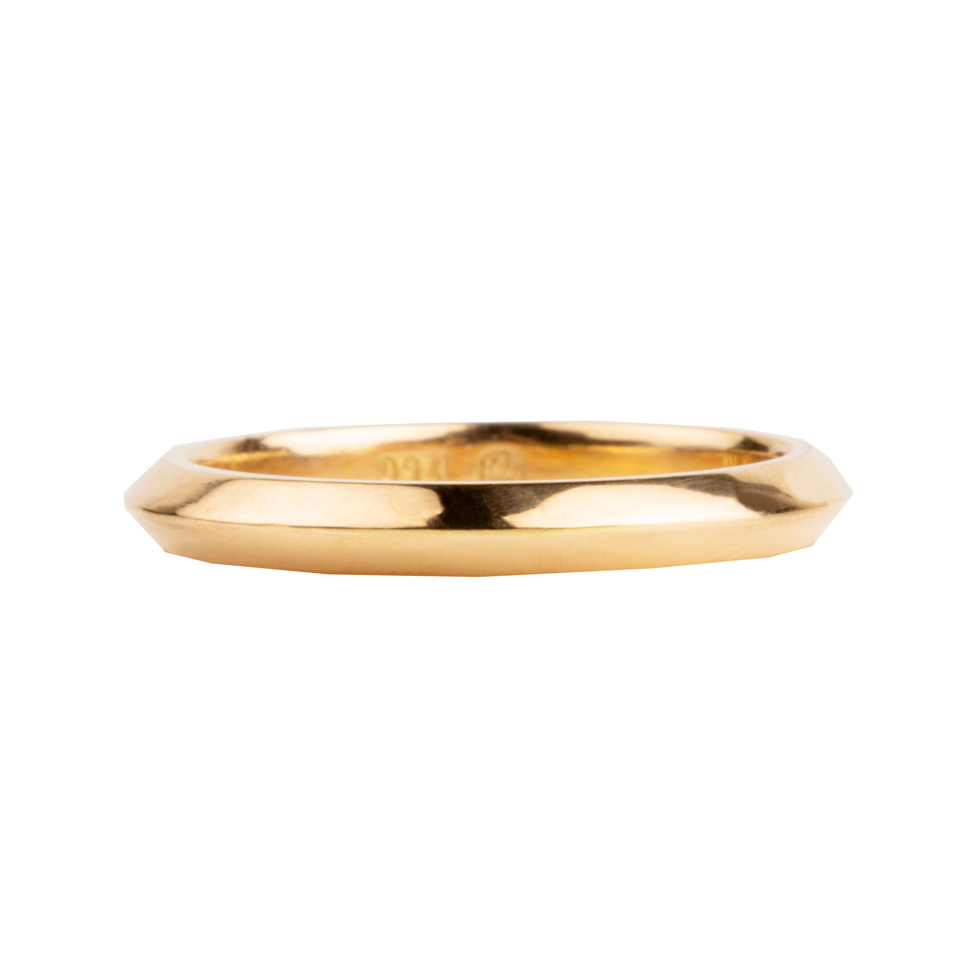 A 2mm knife edge wedding band in 18k yellow gold, with a slightly rounded profile.