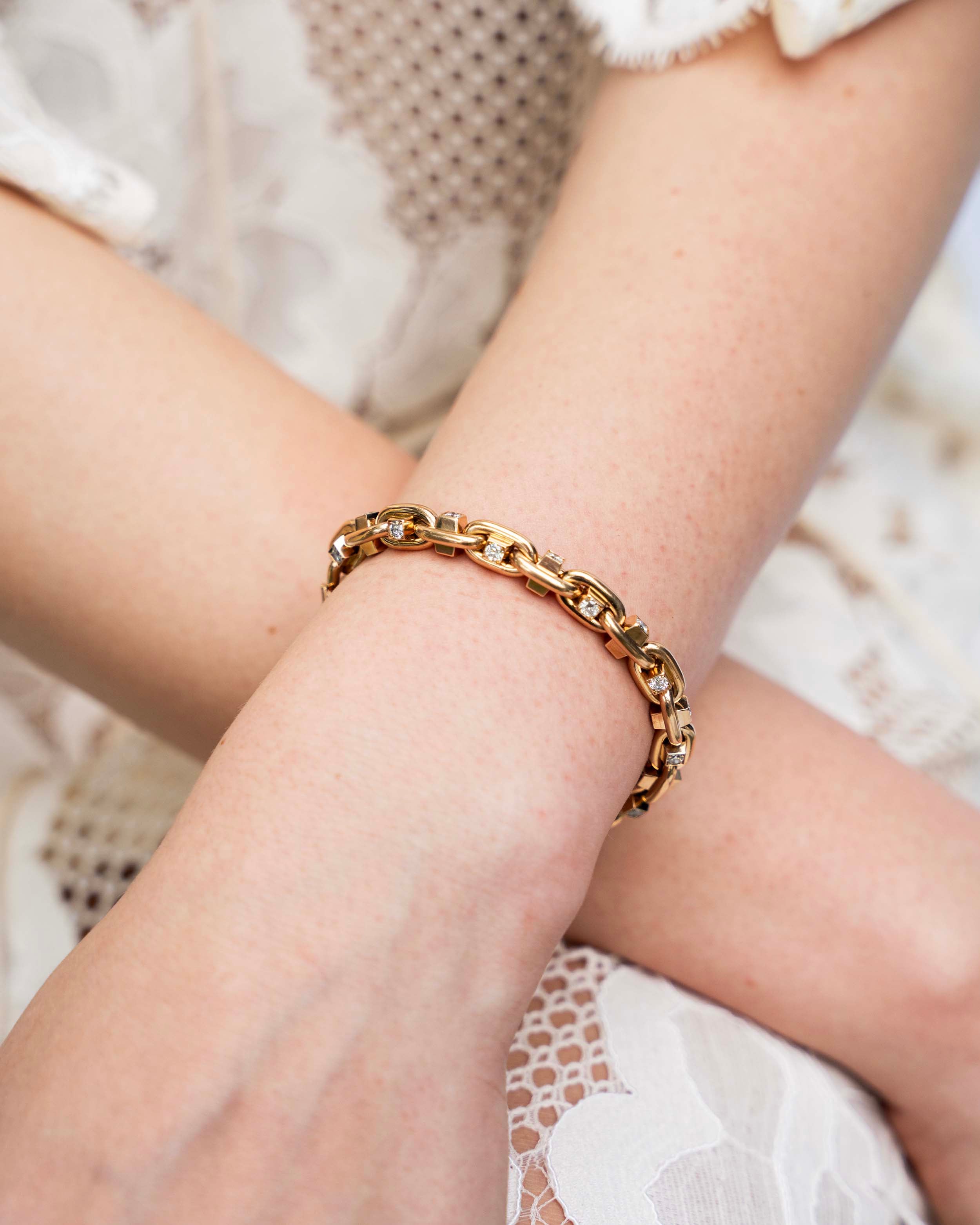 Bell and Bird diamond hobnail bracelet. Over 3 carats of old European cut diamonds are set in the links of the bracelet. The integrated clasp is entirely engineered and manufactured in our workshop. The natural diamonds are estimated to be G-H in color and VS clarity. This version is in our 18k old gold and measures 7.5 inches. The length can be adjusted.