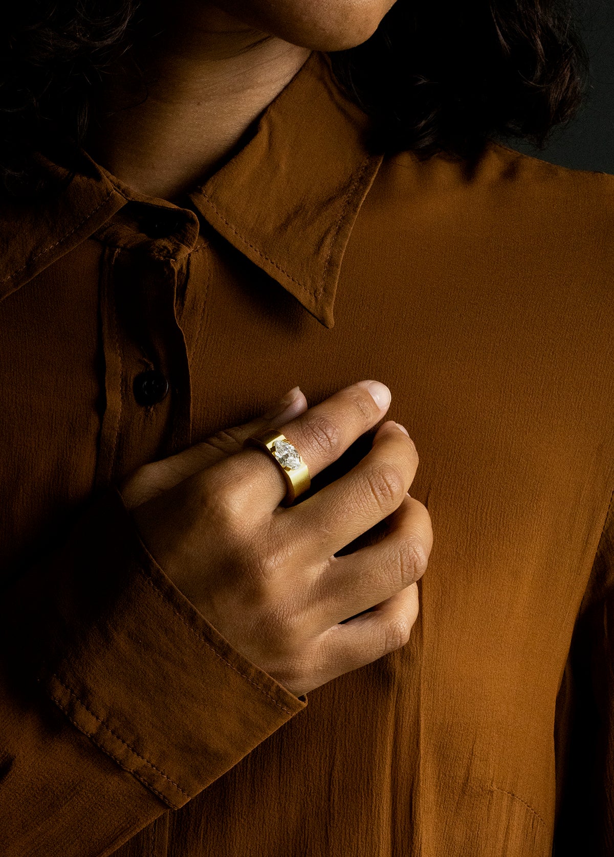 Oversize solitaire setting inspired by the ancient Roman high carat gold stir-up shaped rings we have handled. The tab prongs setting allows for a minimal yet bold setting. This ring features a moval cut diamond of 2.05 carats, F color and VS1 clarity. Made in our custom 18k yellow gold with a subtle soft finished polish.