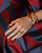 One of our signature designs. Each ring features a unique collection of slightly graduated antique diamonds. Collecting a suite of stones in matched size, color, and clarity often takes months. This ring features sixteen turn-of-the-century, old European cut diamonds, approximately 4.41 carats in total diamond weight The diamond grades range from approximately H-J color and VS-SI clarity. Being modeled on a hand.