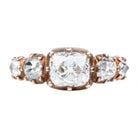 A handmade 5 stone old mine cut diamond ring with a 1.76 carat center diamond and descending side stones, set in a custom blend of 18K rose gold.