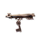 Tiny Victorian era Rose cut diamond arrow brooch with the tiniest key hanging from a laurel wreath. Silver topped gold with original clasp fixture. English in Origin. Circa 1860. Back-up view.